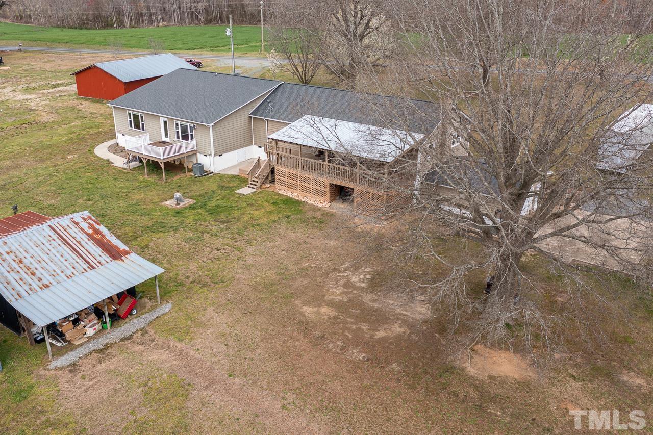6668 Roby Coe Road Ramseur, NC 27316 - Photo 34 of 59 an aerial view of a house with a yard