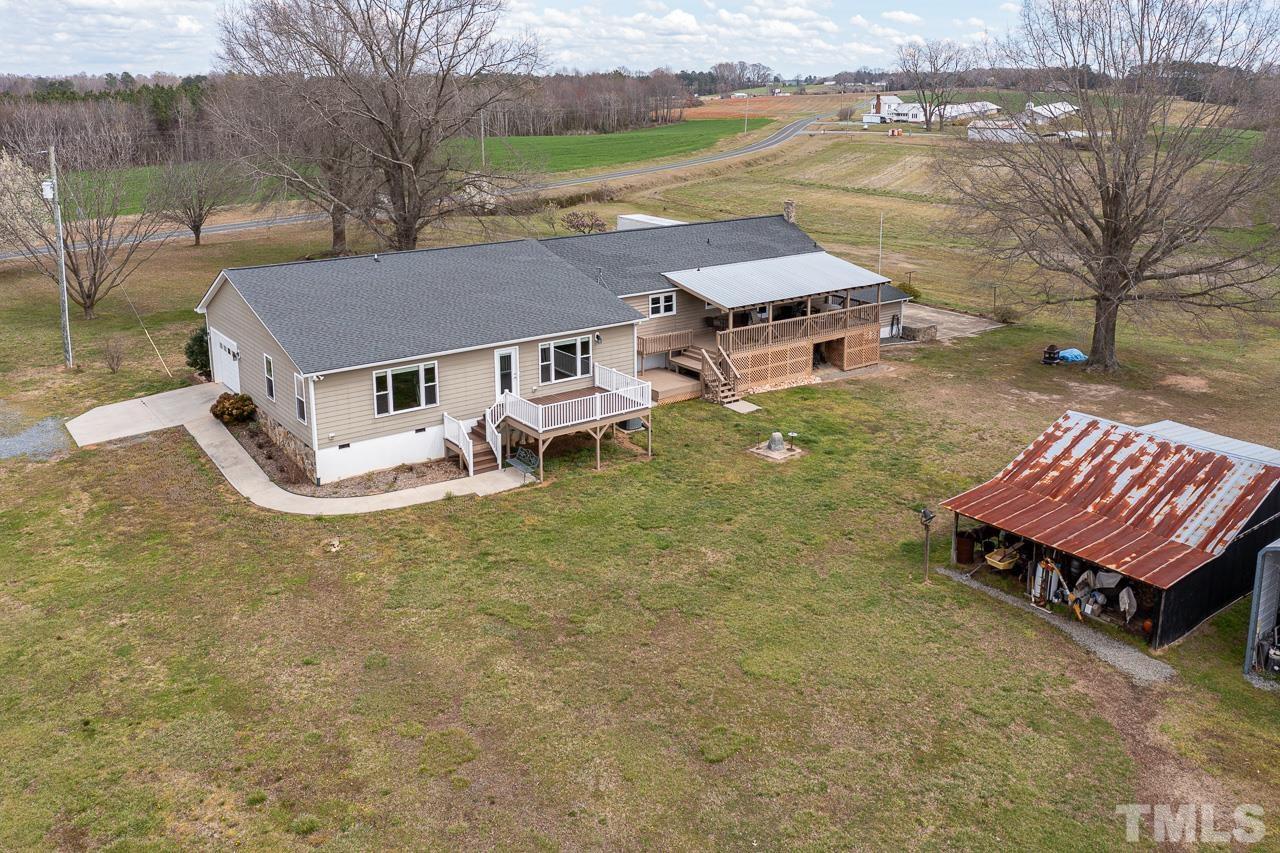 6668 Roby Coe Road Ramseur, NC 27316 - Photo 35 of 59 an aerial view of a house with garden space and lake view