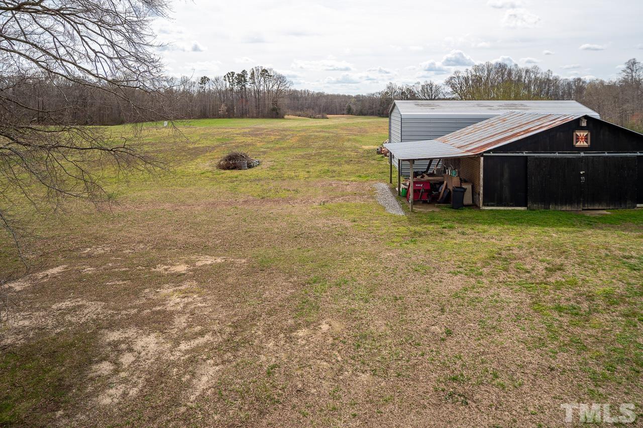 6668 Roby Coe Road Ramseur, NC 27316 - Photo 45 of 59 a view of a house with yard and lake view