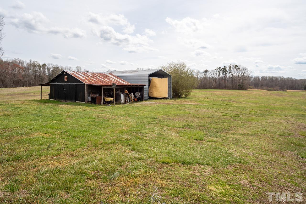 6668 Roby Coe Road Ramseur, NC 27316 - Photo 48 of 59 a view of a house with a yard and a sink