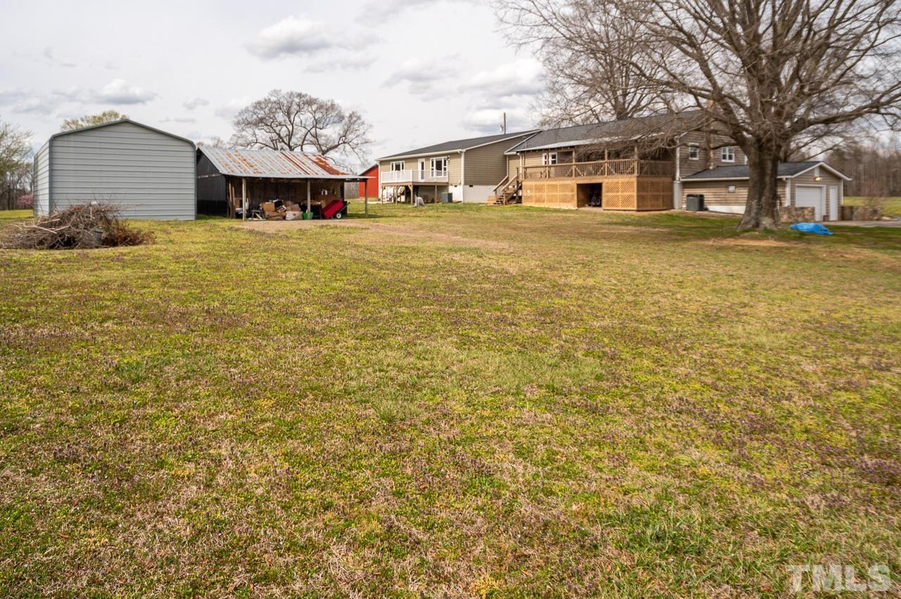 6668 Roby Coe Road Ramseur, NC 27316 - Photo 53 of 59 a front view of a house with a yard