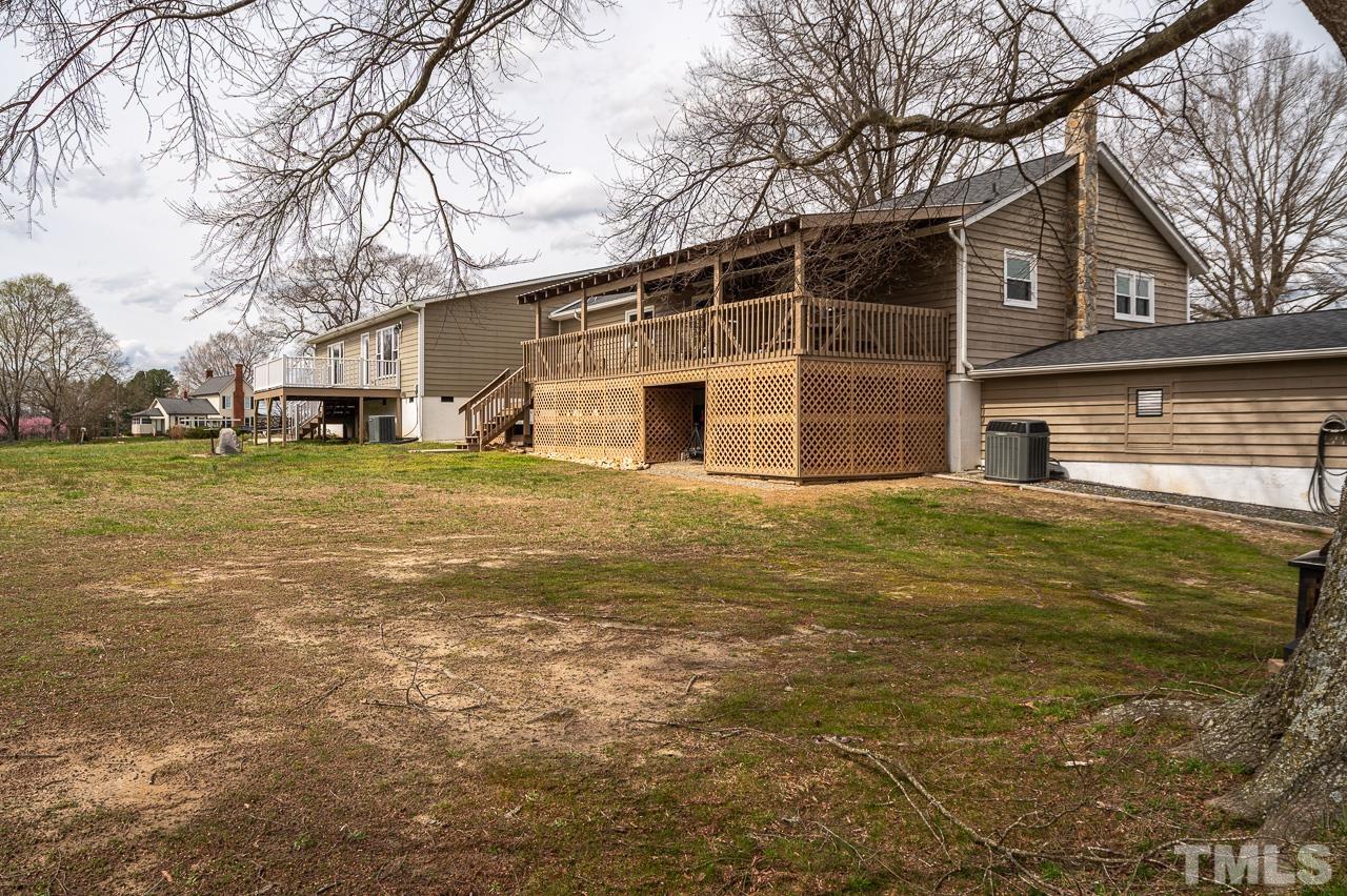 6668 Roby Coe Road Ramseur, NC 27316 - Photo 54 of 59 a view of a house with a yard