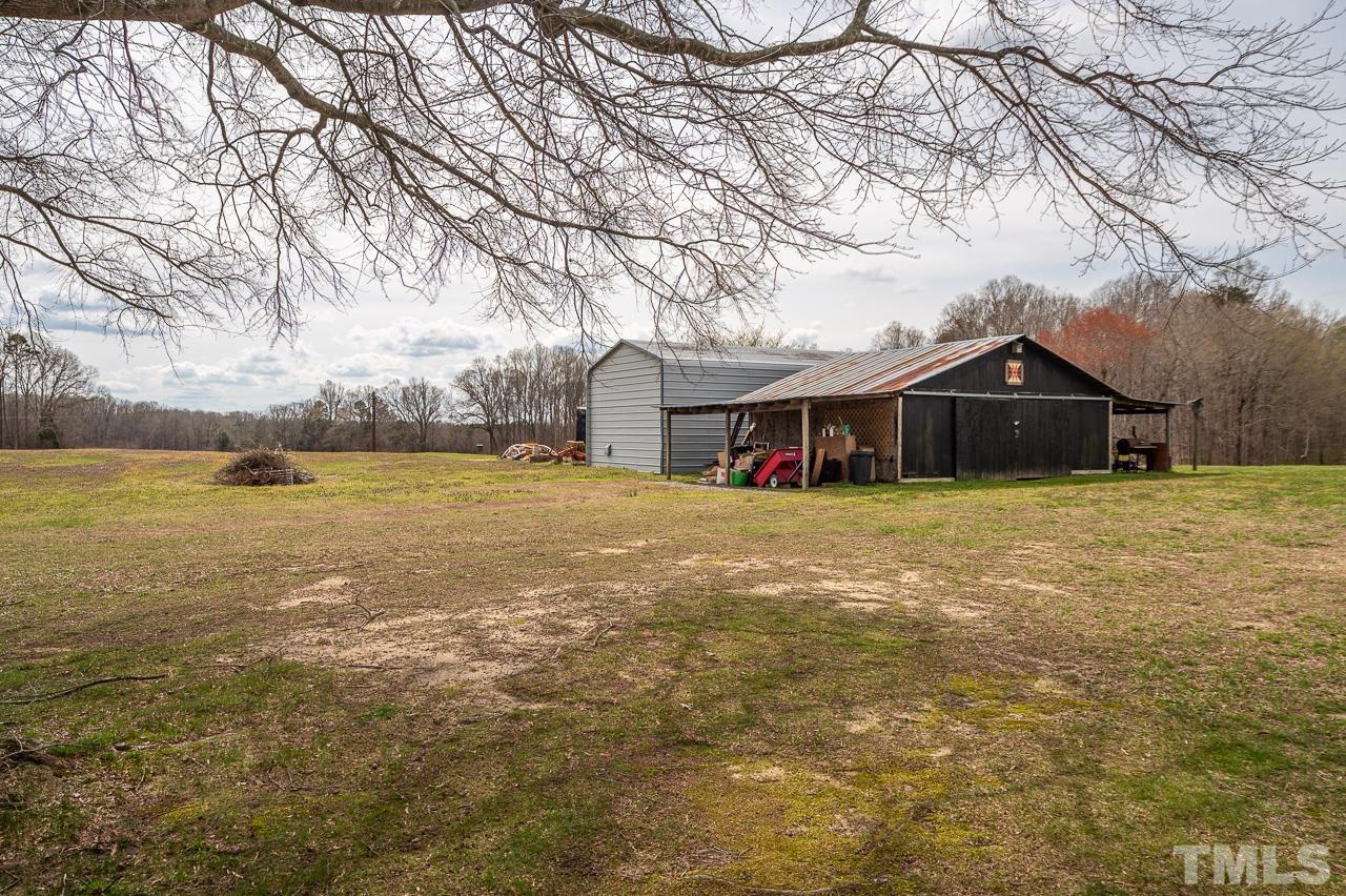 6668 Roby Coe Road Ramseur, NC 27316 - Photo 55 of 59 a view of a house with a yard