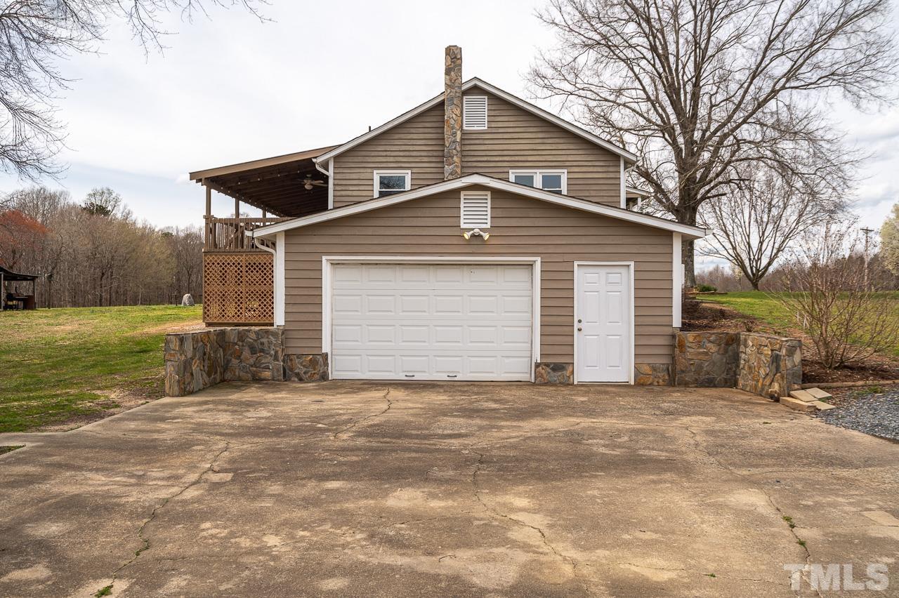 6668 Roby Coe Road Ramseur, NC 27316 - Photo 56 of 59 a front view of a house with a yard