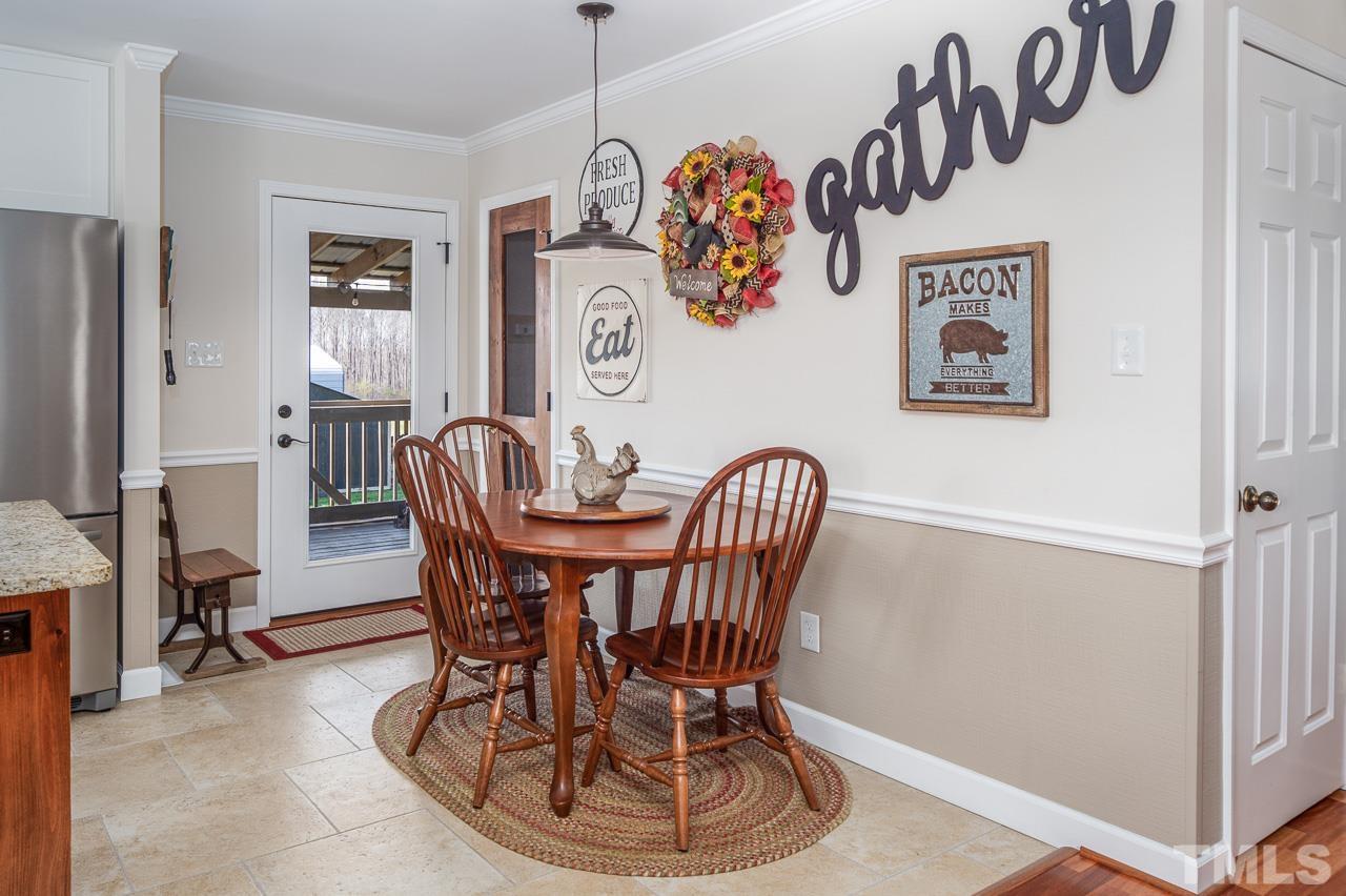 6668 Roby Coe Road Ramseur, NC 27316 - Photo 7 of 59 a view of a dining room with furniture