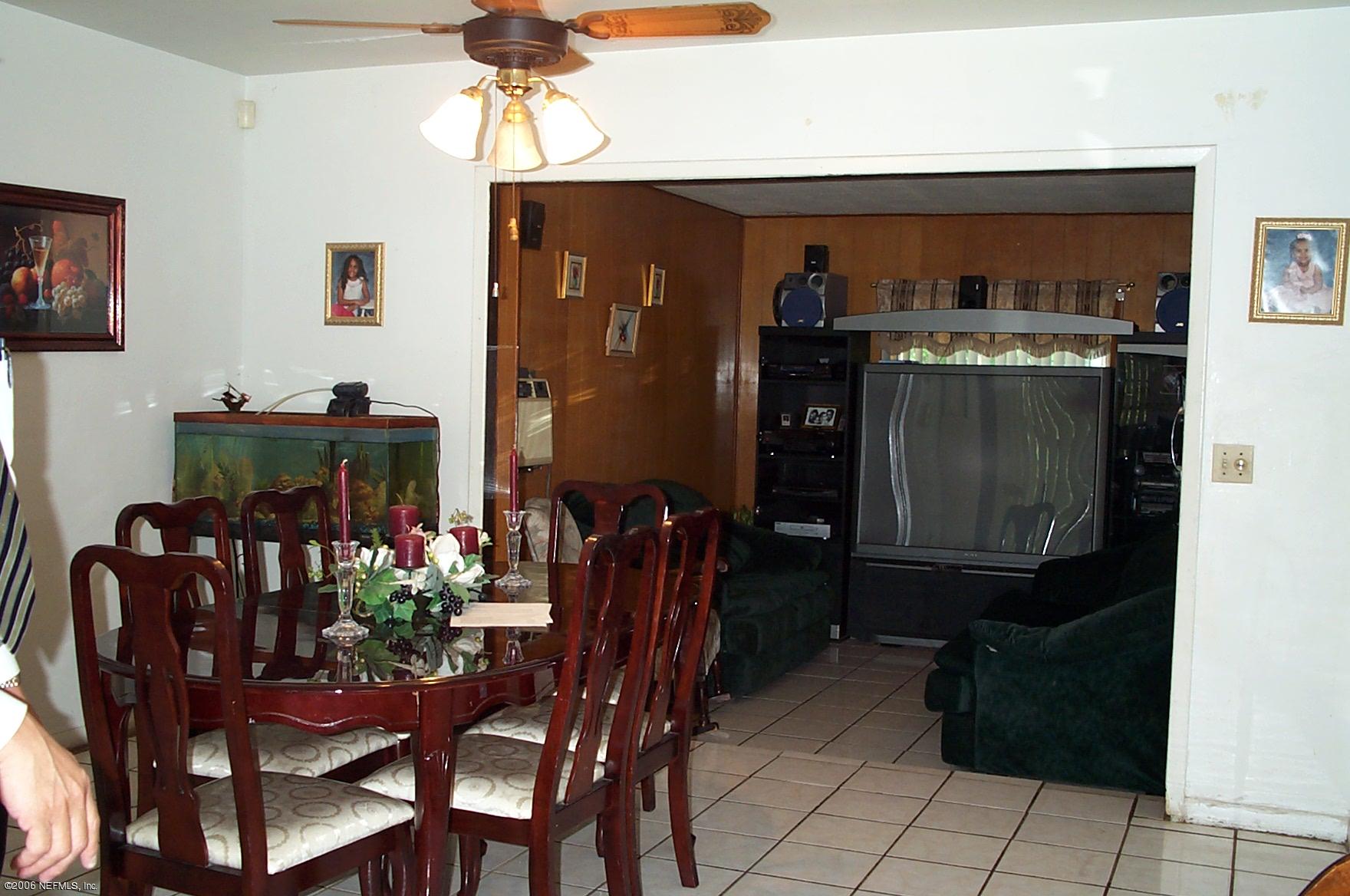 7336 Strato Road Jacksonville, FL 32210 - Photo 2 of 2 a dining room with furniture and window