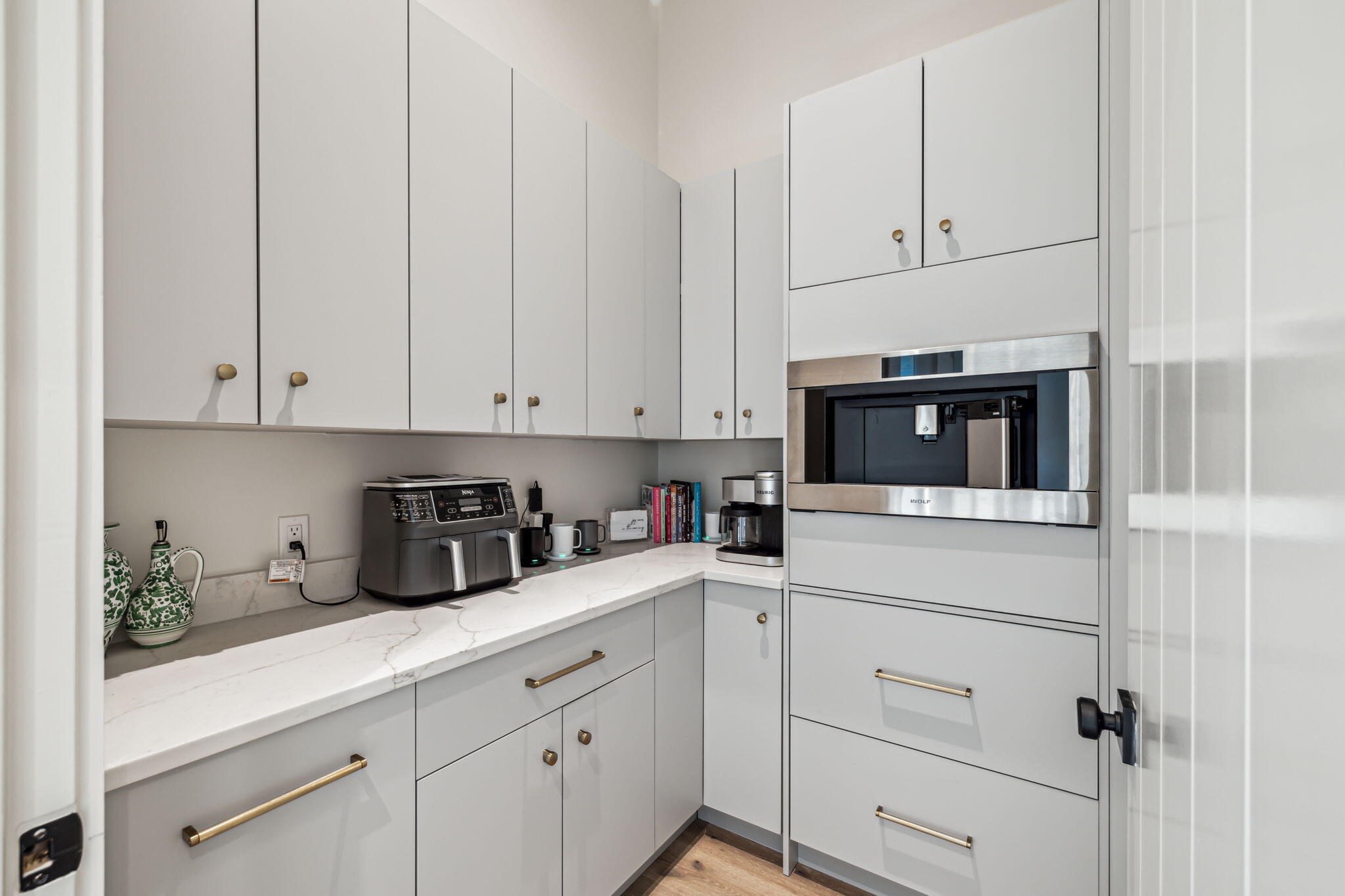 11 Sundew Pl Inlet Beach Inlet Beach, FL 32461 - Photo 14 of 51 a kitchen with white cabinets and white appliances