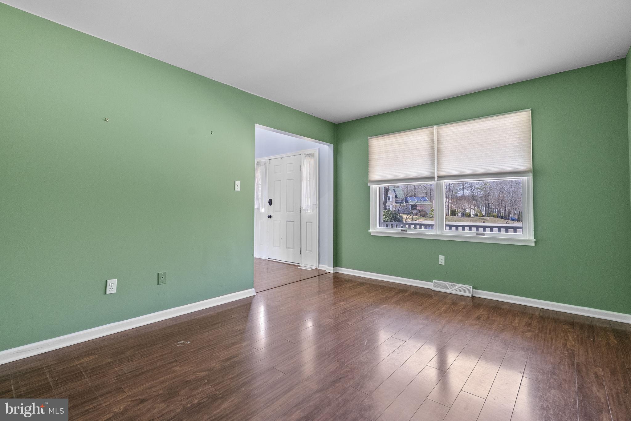 218 Crestview Avenue Absecon, NJ 08205 - Photo 11 of 67 an empty room with wooden floor and a window