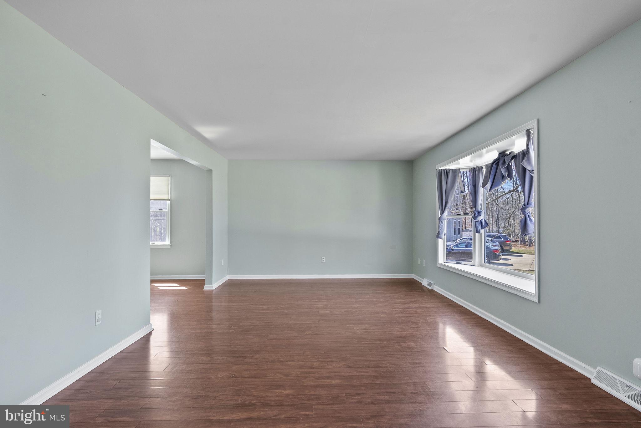 218 Crestview Avenue Absecon, NJ 08205 - Photo 12 of 67 a view of an empty room with window and wooden floor