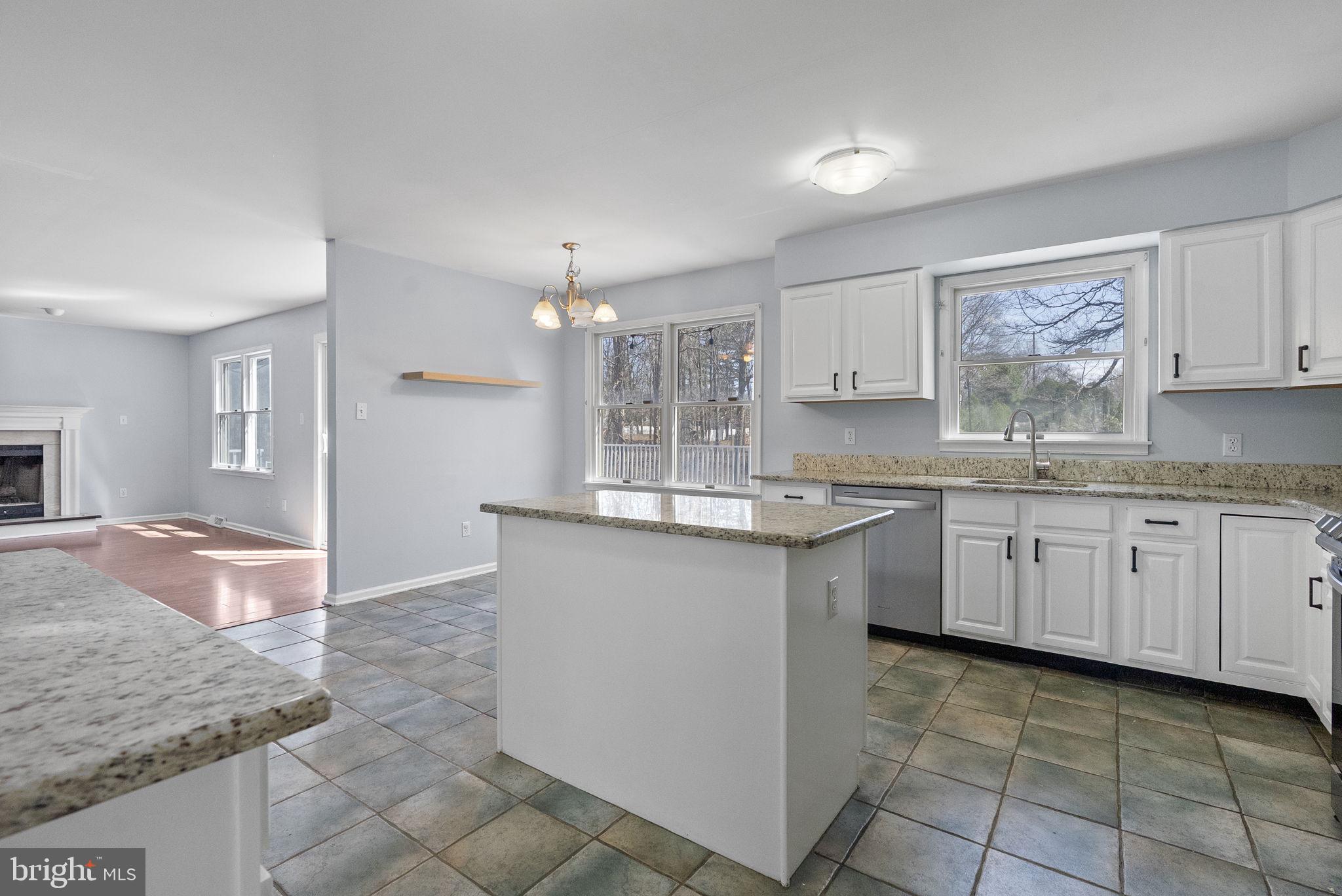 218 Crestview Avenue Absecon, NJ 08205 - Photo 16 of 67 a kitchen with granite countertop a sink and cabinets