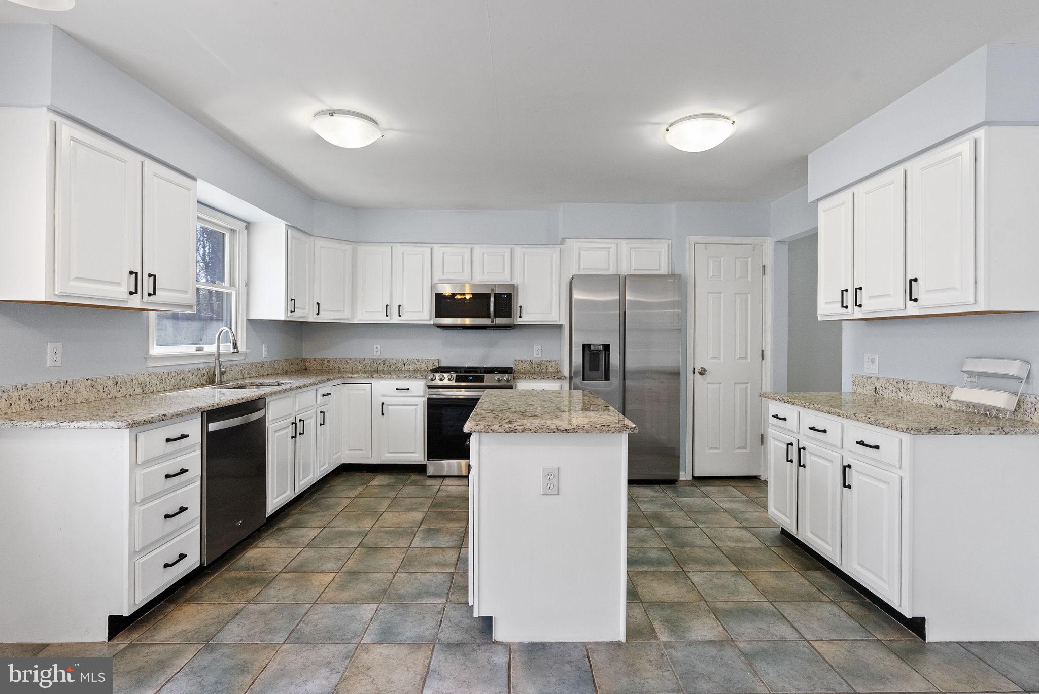 218 Crestview Avenue Absecon, NJ 08205 - Photo 17 of 67 a kitchen with cabinets stainless steel appliances and a sink