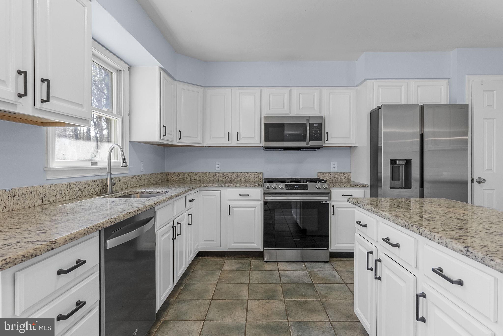 218 Crestview Avenue Absecon, NJ 08205 - Photo 20 of 67 a kitchen with cabinets appliances a sink and a counter top space