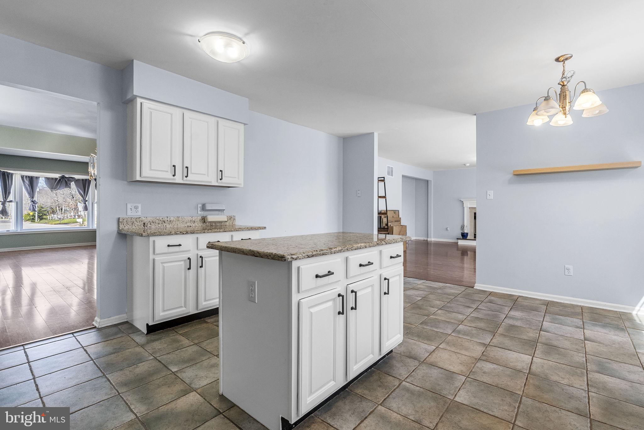 218 Crestview Avenue Absecon, NJ 08205 - Photo 21 of 67 a kitchen with granite countertop white cabinets and white appliances