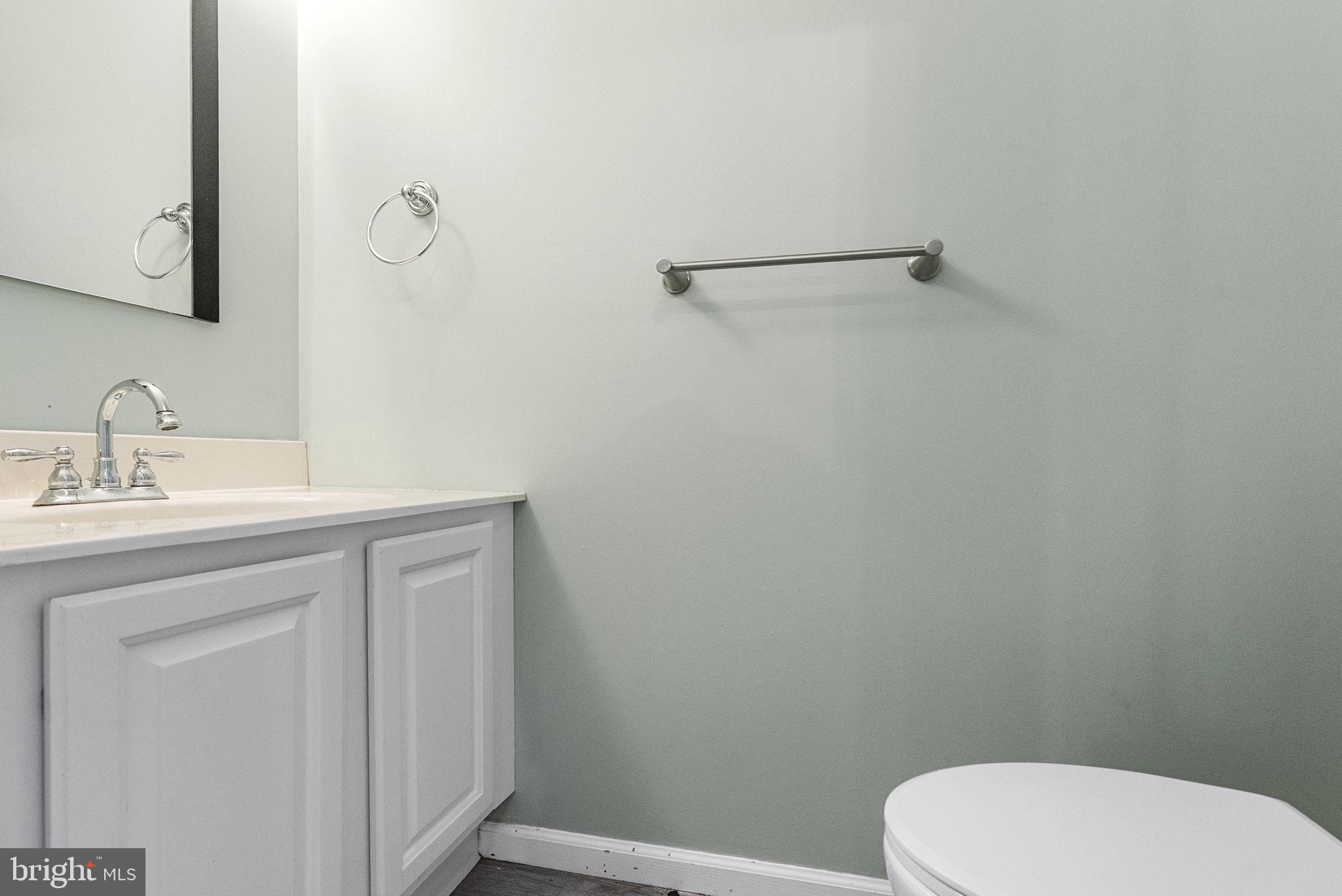 218 Crestview Avenue Absecon, NJ 08205 - Photo 26 of 67 a bathroom with a toilet a sink and mirror