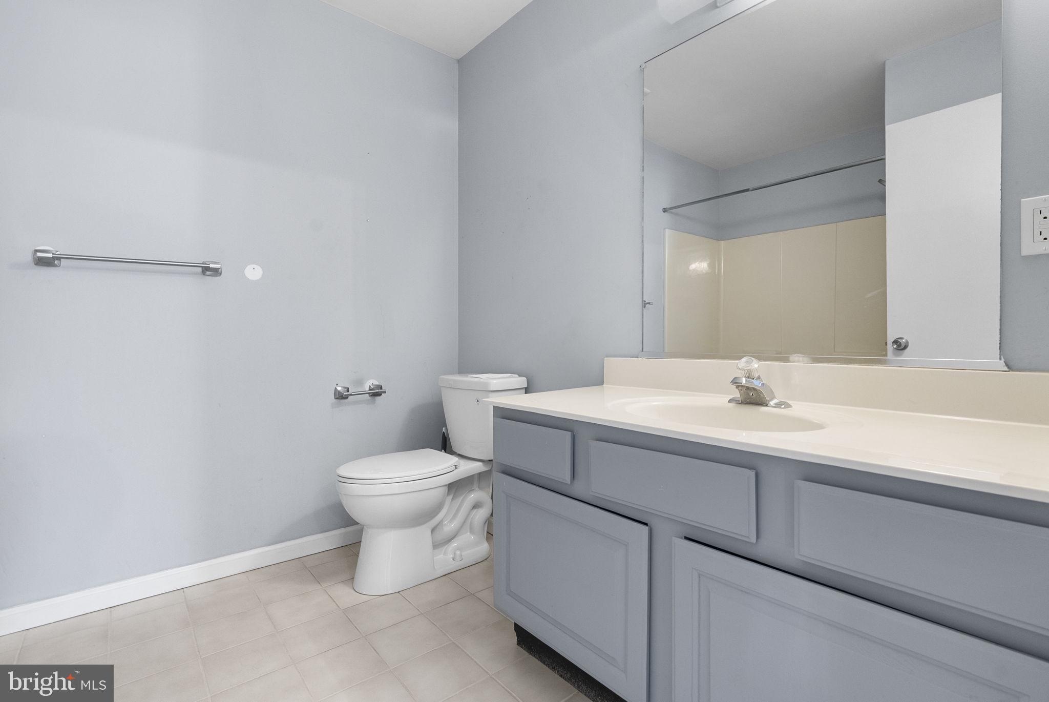 218 Crestview Avenue Absecon, NJ 08205 - Photo 36 of 67 a bathroom with a sink toilet and a mirror