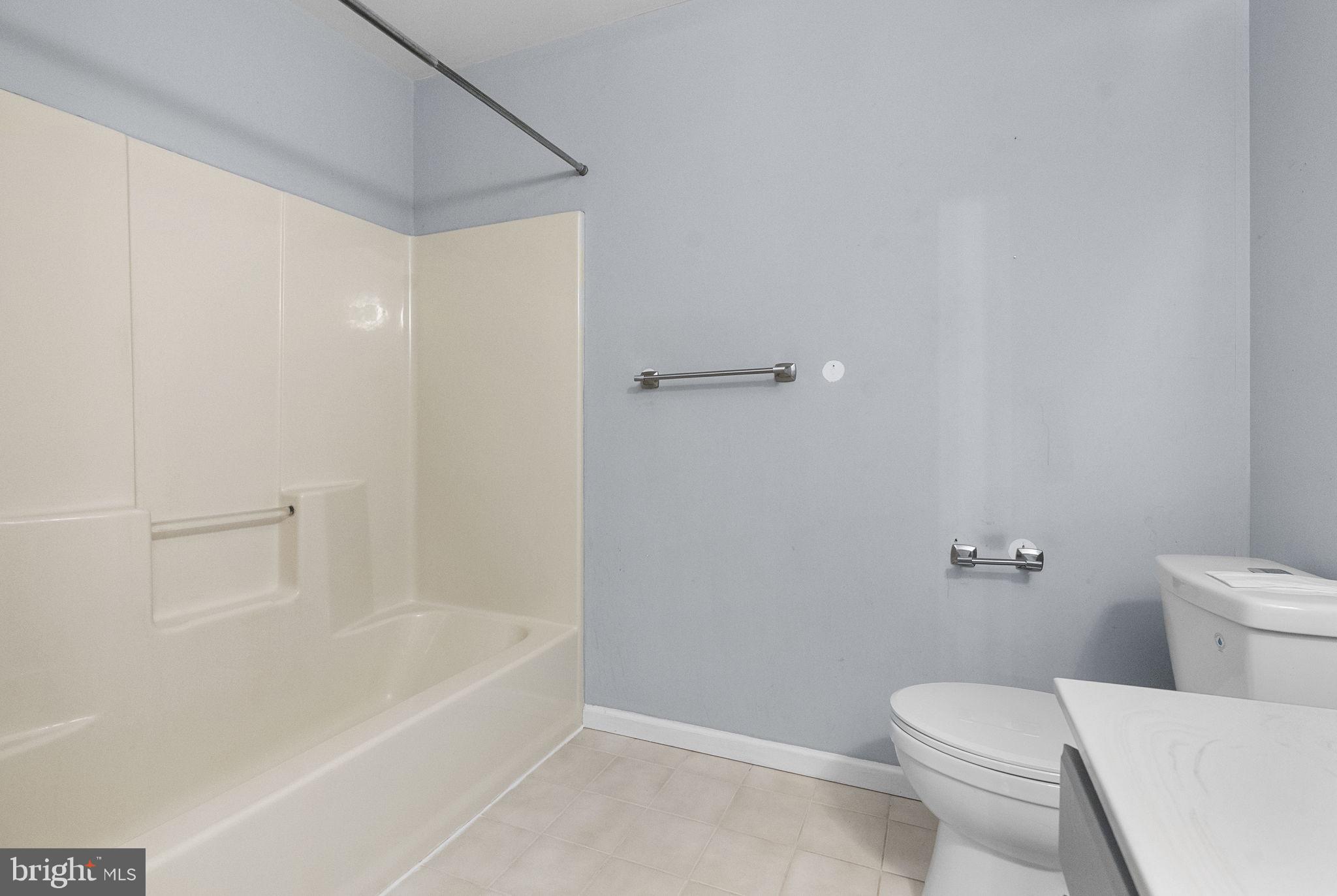 218 Crestview Avenue Absecon, NJ 08205 - Photo 37 of 67 a white toilet sitting next to a bath tub