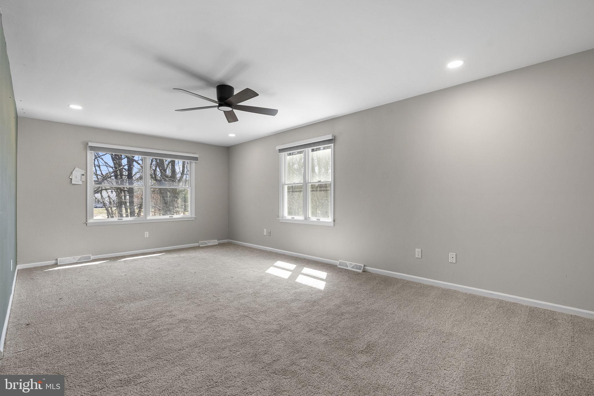 218 Crestview Avenue Absecon, NJ 08205 - Photo 40 of 67 an empty room with windows and ceiling fan