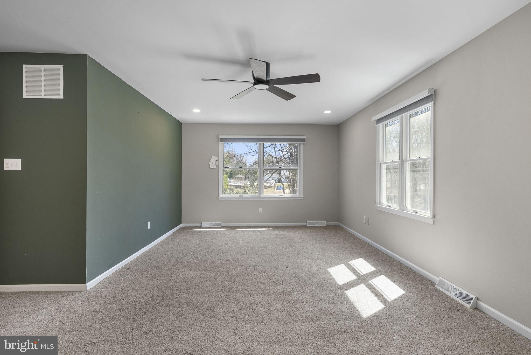 218 Crestview Avenue Absecon, NJ 08205 - Photo 41 of 67 an empty room with windows and fan