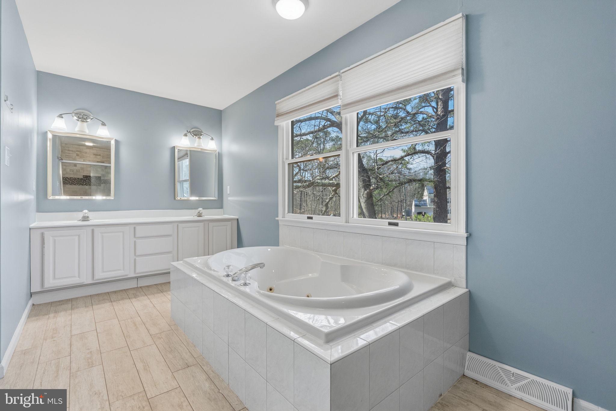 218 Crestview Avenue Absecon, NJ 08205 - Photo 49 of 67 a bathroom with a tub a sink and a window
