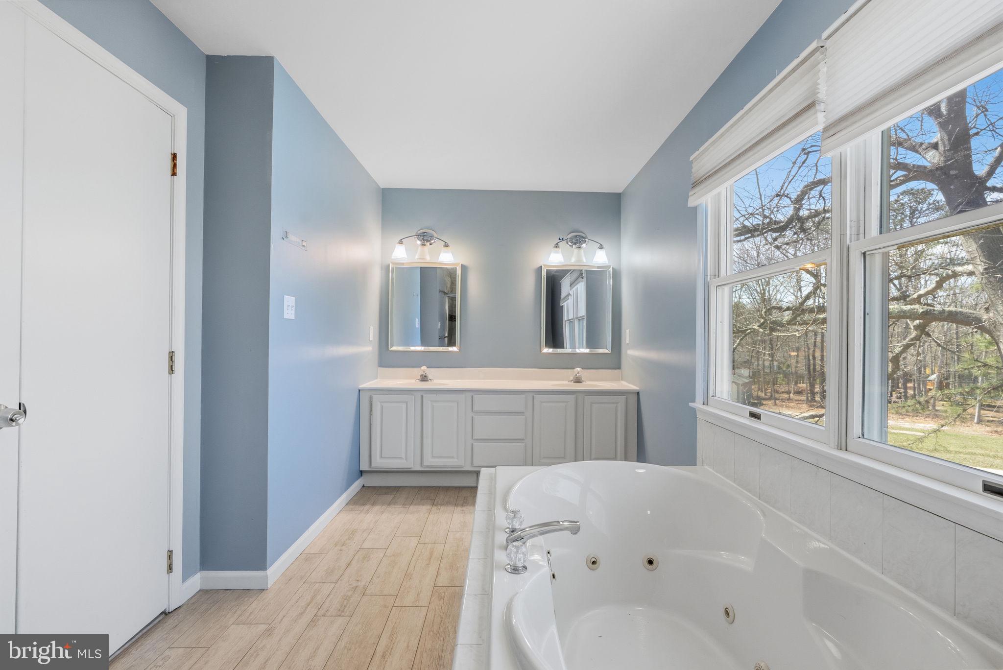 218 Crestview Avenue Absecon, NJ 08205 - Photo 50 of 67 a large bathroom with a bathtub and a sink