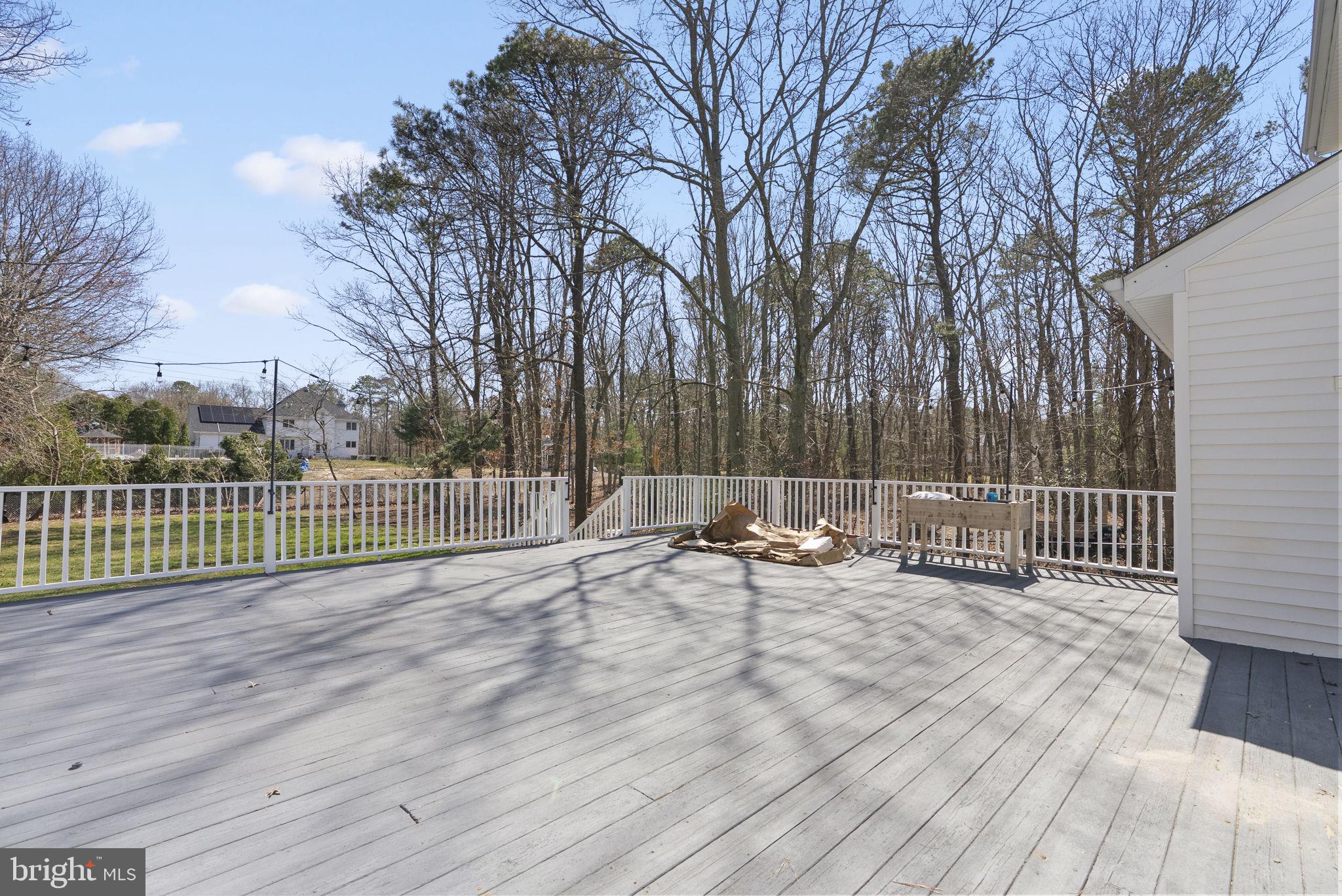 218 Crestview Avenue Absecon, NJ 08205 - Photo 57 of 67 a view of a bench and trees in the front of a house