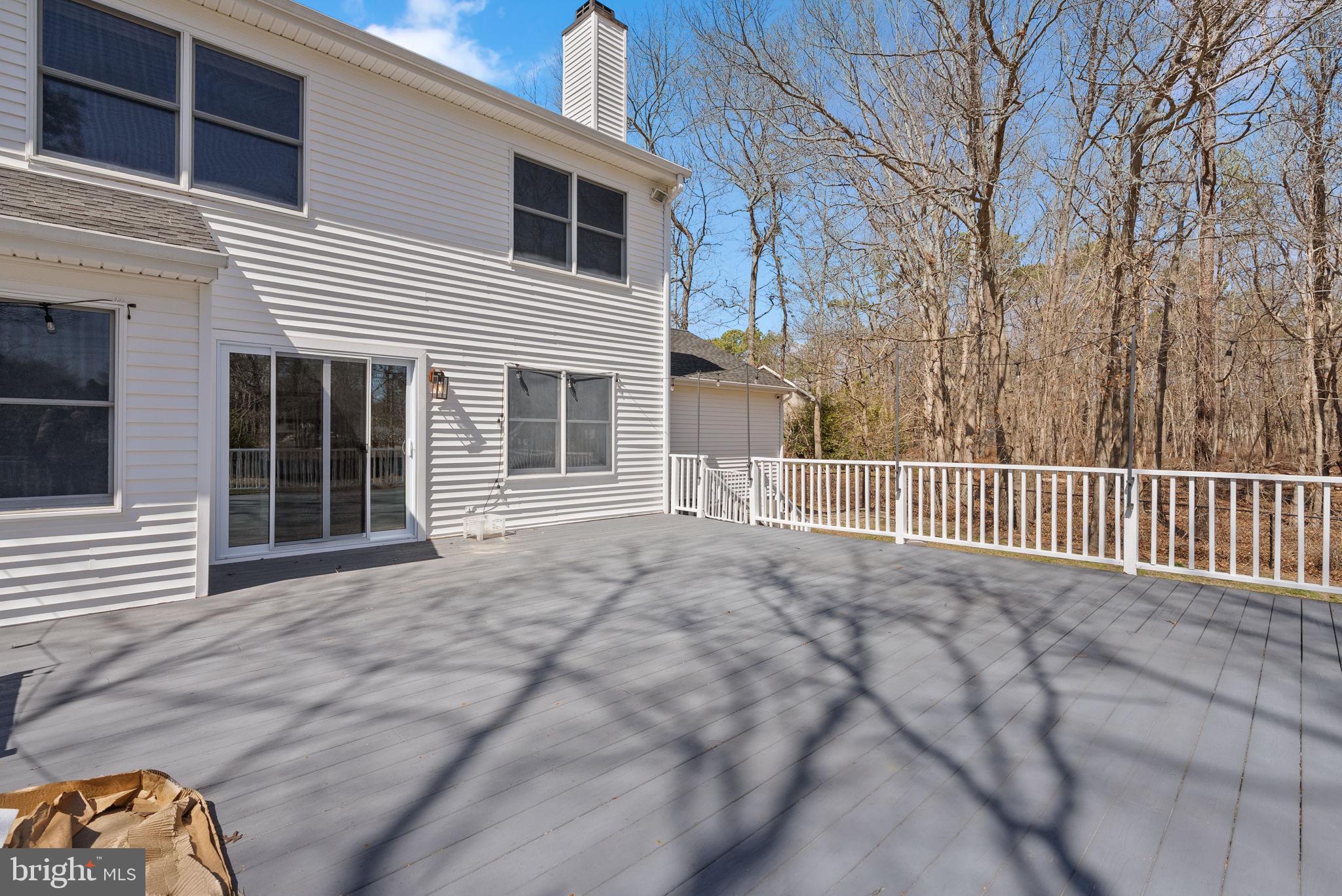 218 Crestview Avenue Absecon, NJ 08205 - Photo 58 of 67 a view of a house with a small yard and wooden fence