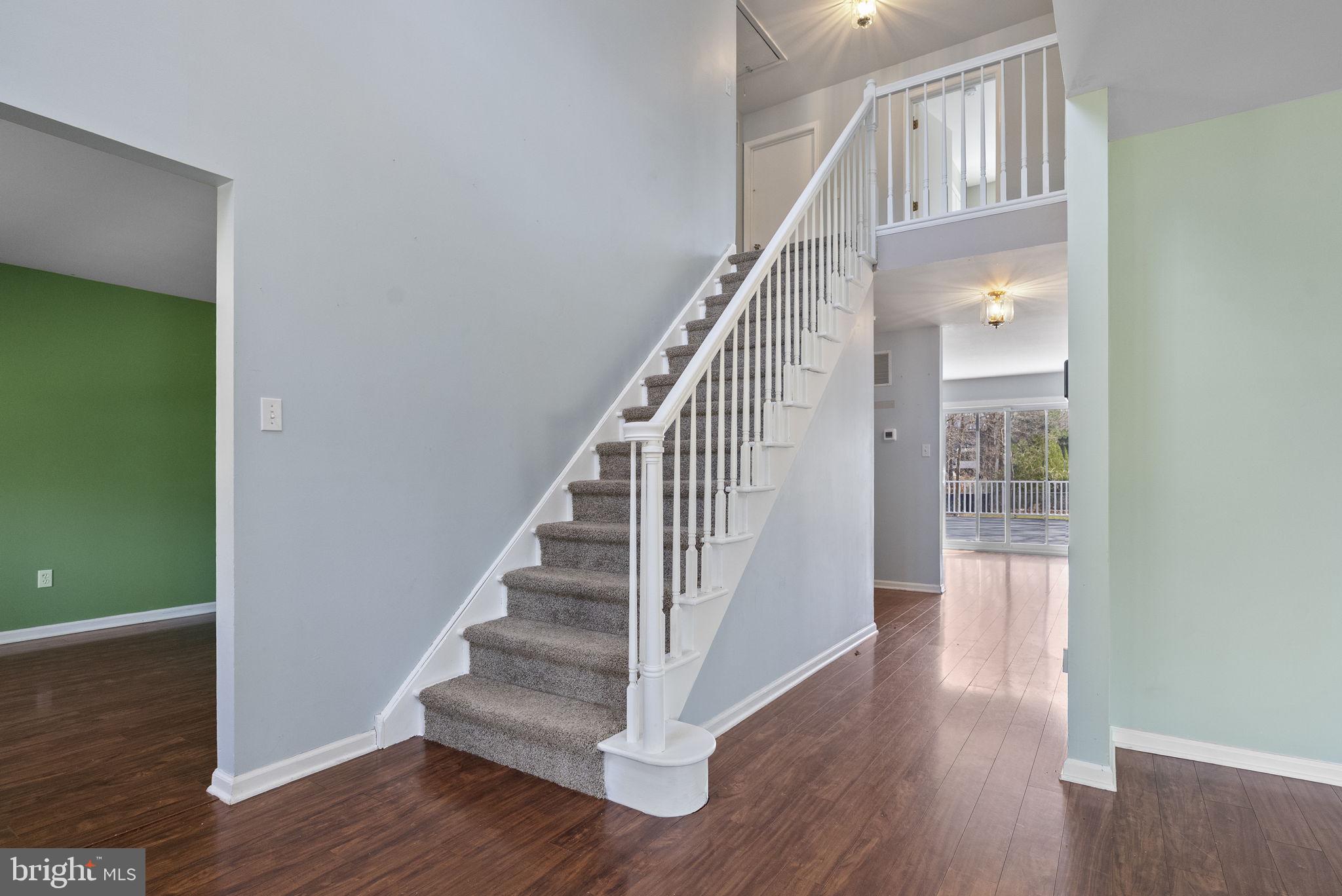 218 Crestview Avenue Absecon, NJ 08205 - Photo 6 of 67 a view of staircase with wooden floor and white walls