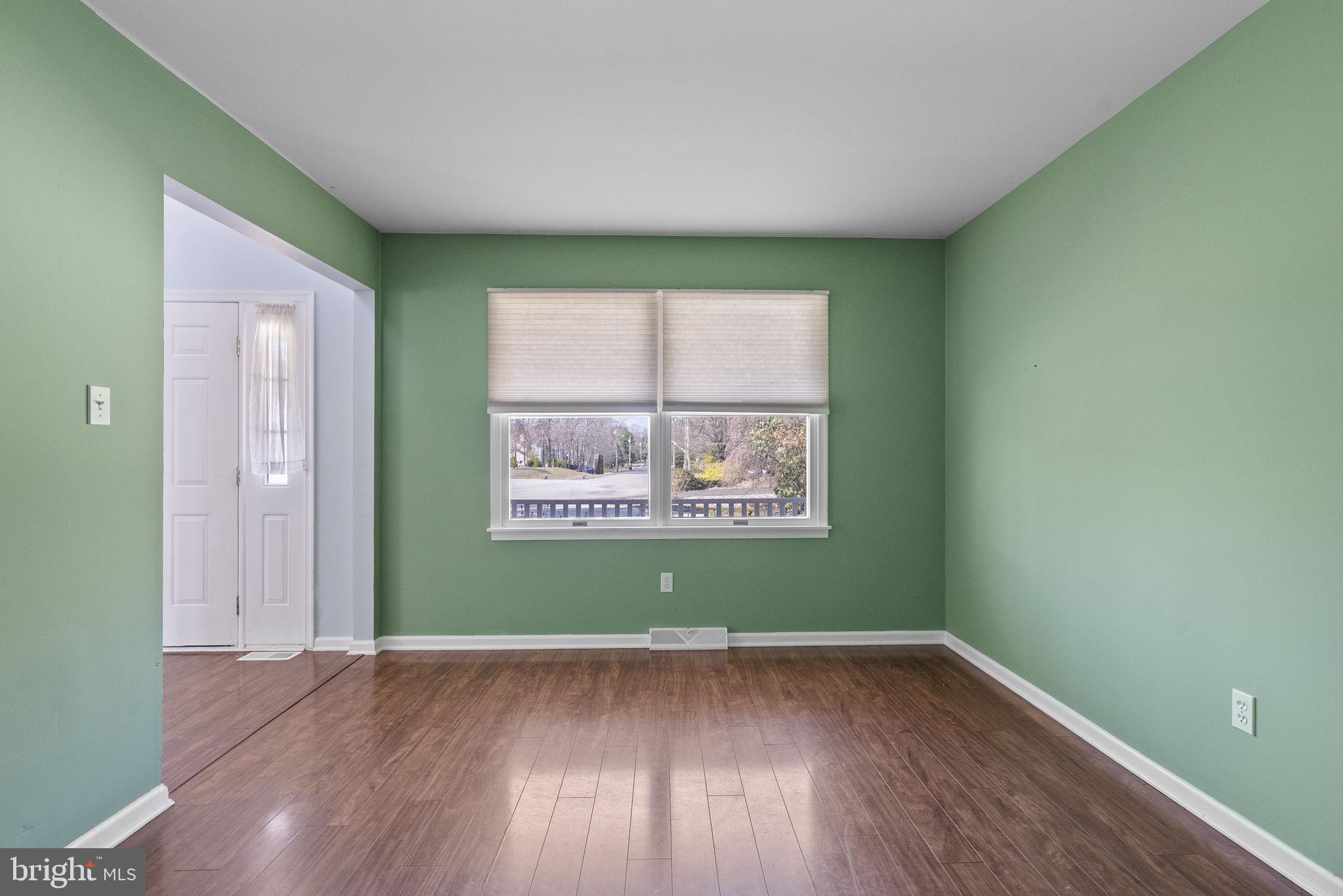 218 Crestview Avenue Absecon, NJ 08205 - Photo 10 of 67 an empty room with wooden floor and a window