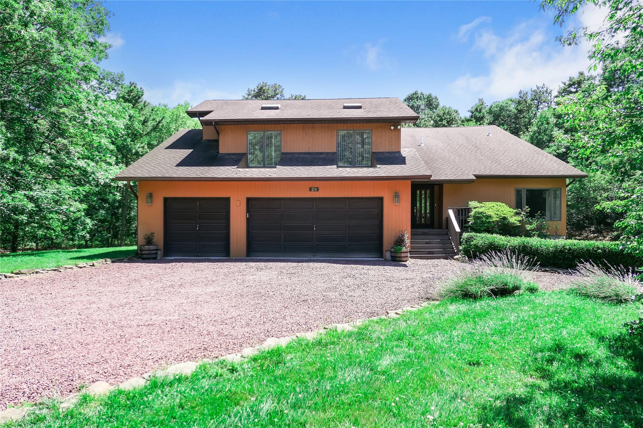 28 Bellhaven Road Bellport, NY 11713 - Photo 1 of 1 View of front of home featuring roof with shingles, driveway, and an attached garage