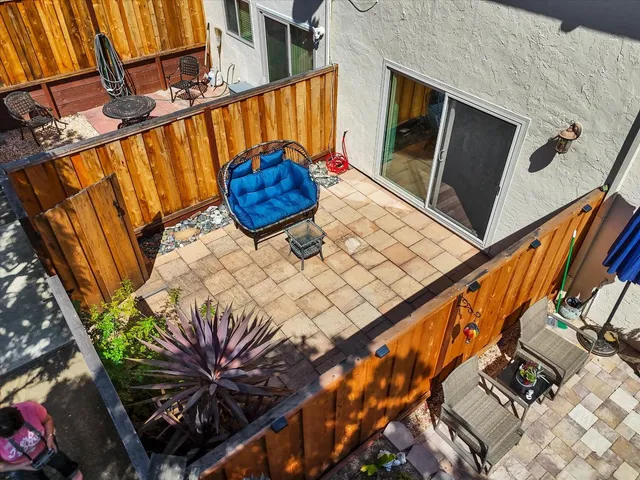 a view of backyard with patio