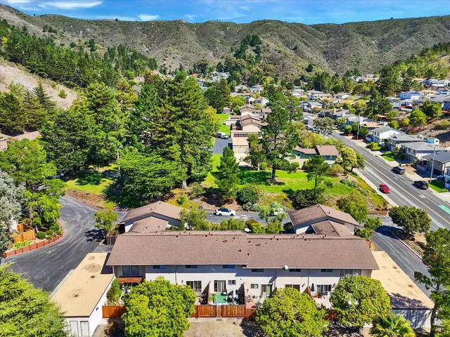 a view of a city with mountains in the background