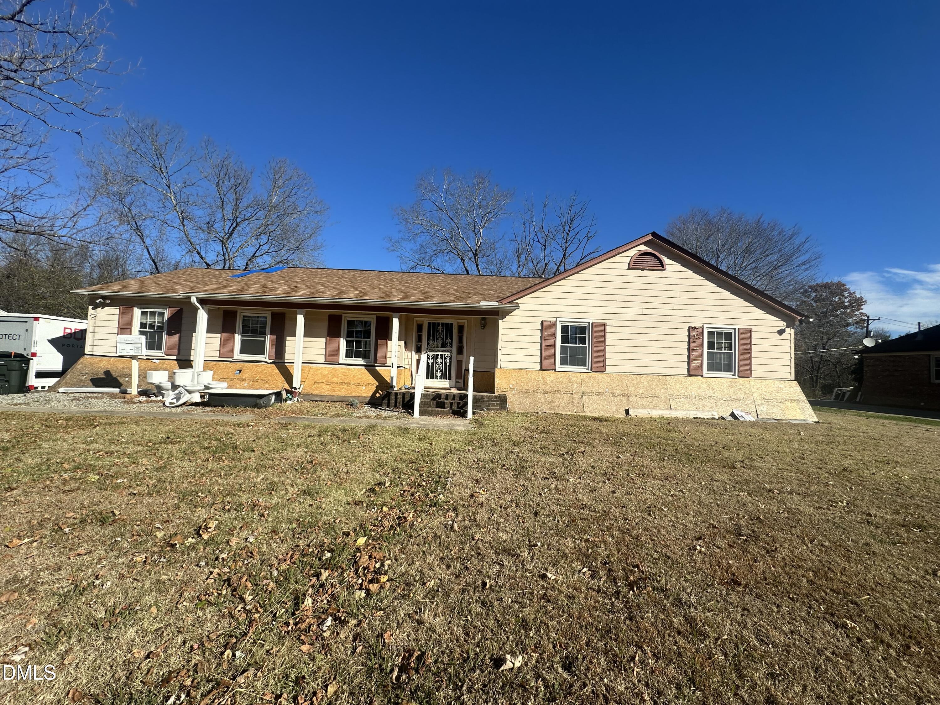 321 Rippling Stream Road Durham, NC 27704 - Photo 2 of 16 a view of a house with a yard