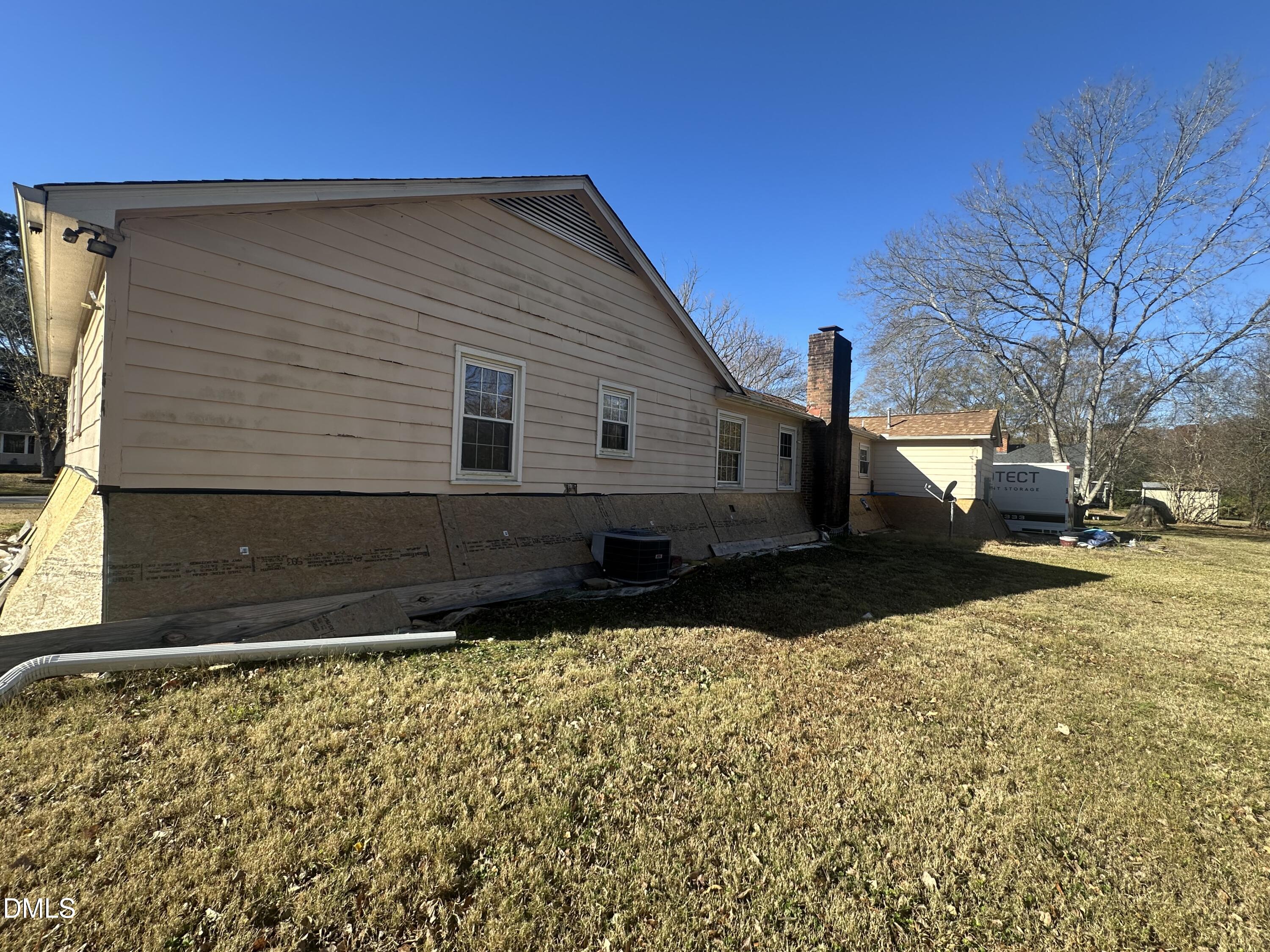 321 Rippling Stream Road Durham, NC 27704 - Photo 4 of 16 a view of a house with a yard