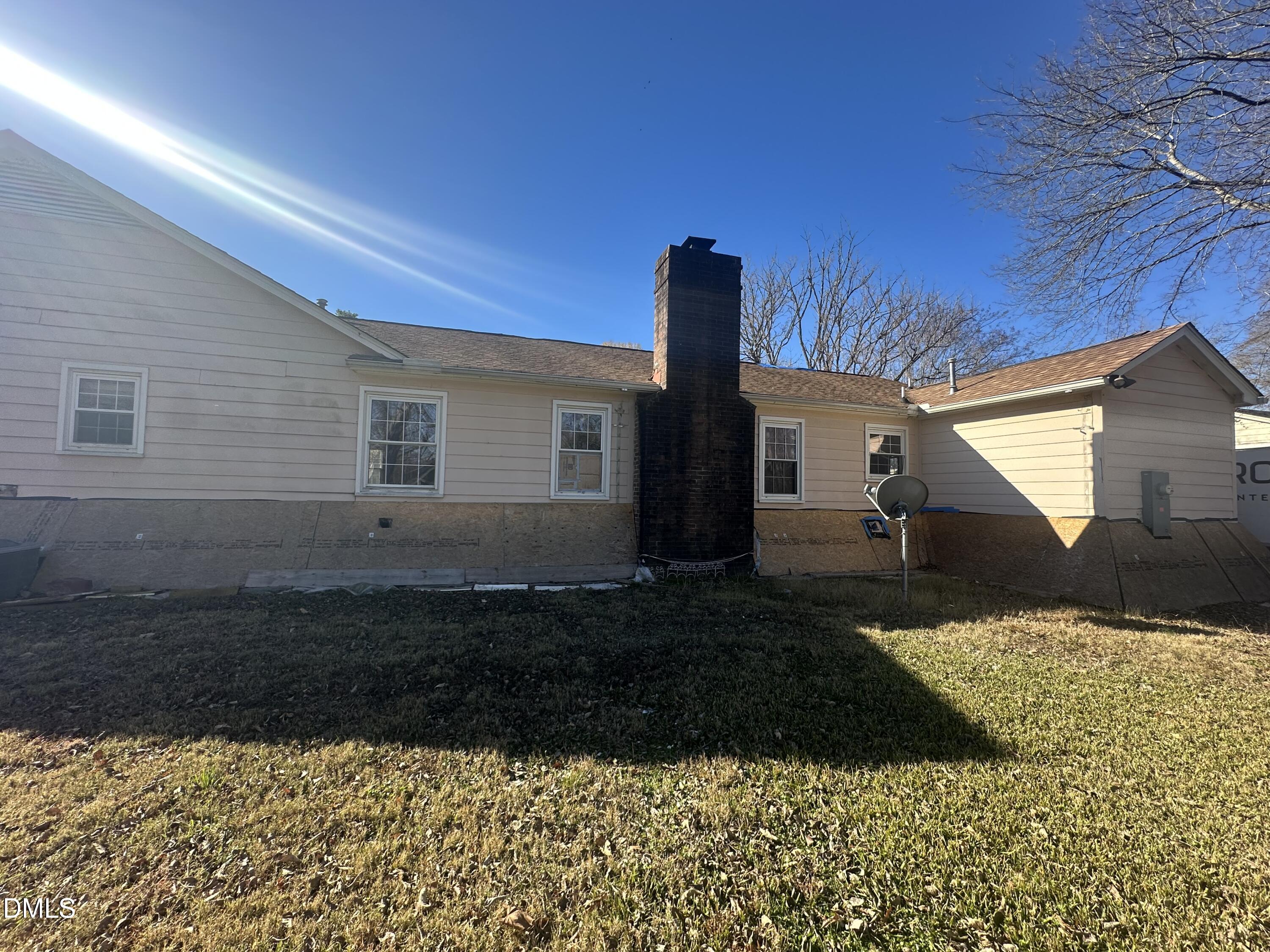 321 Rippling Stream Road Durham, NC 27704 - Photo 5 of 16 a view of a house with a yard