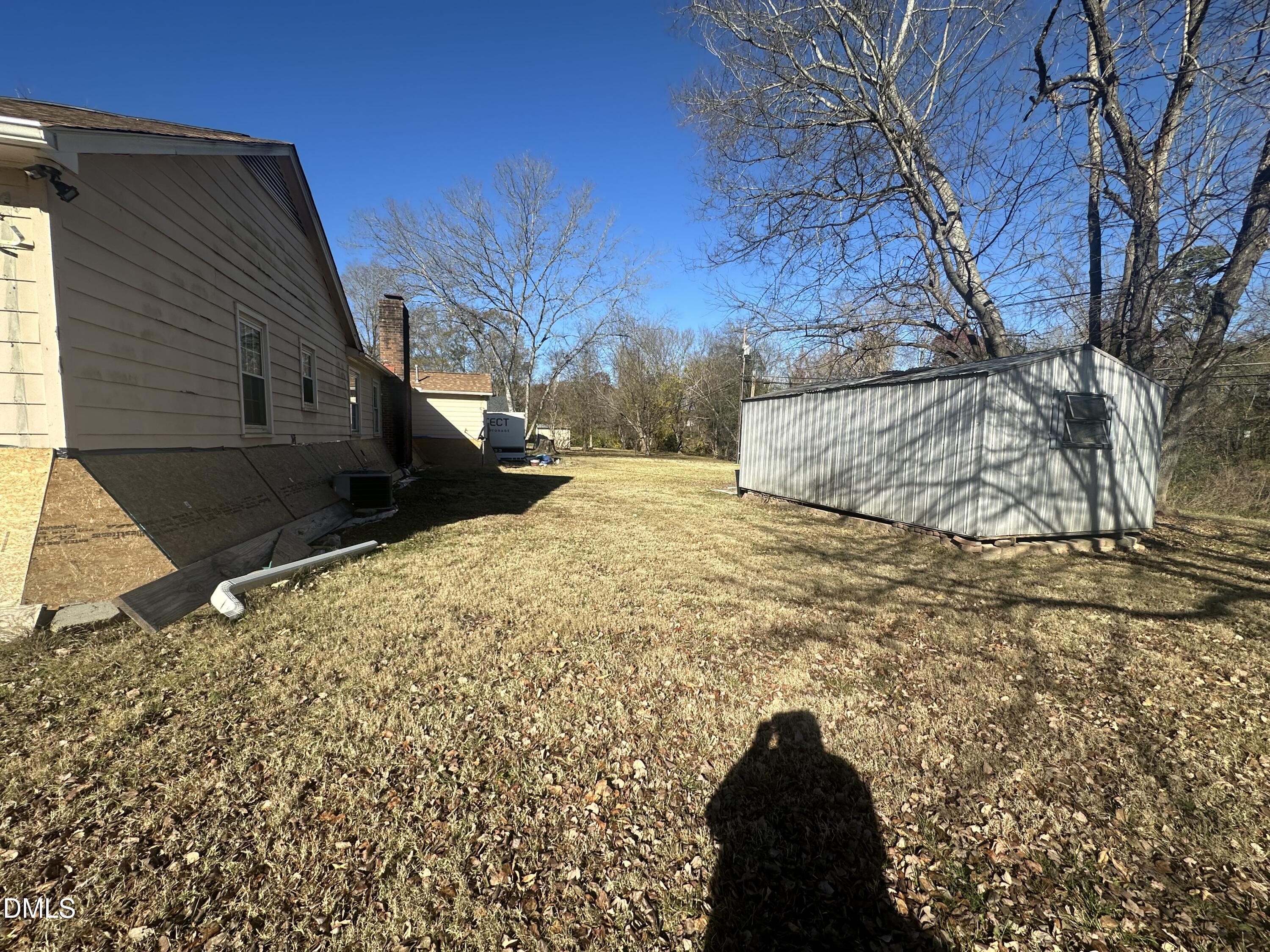 321 Rippling Stream Road Durham, NC 27704 - Photo 6 of 16 a view of a yard with snow on the road