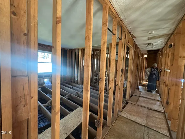 a view of staircase with railing and stairs