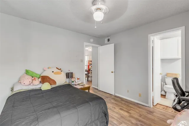 a bedroom with a bed and cabinets