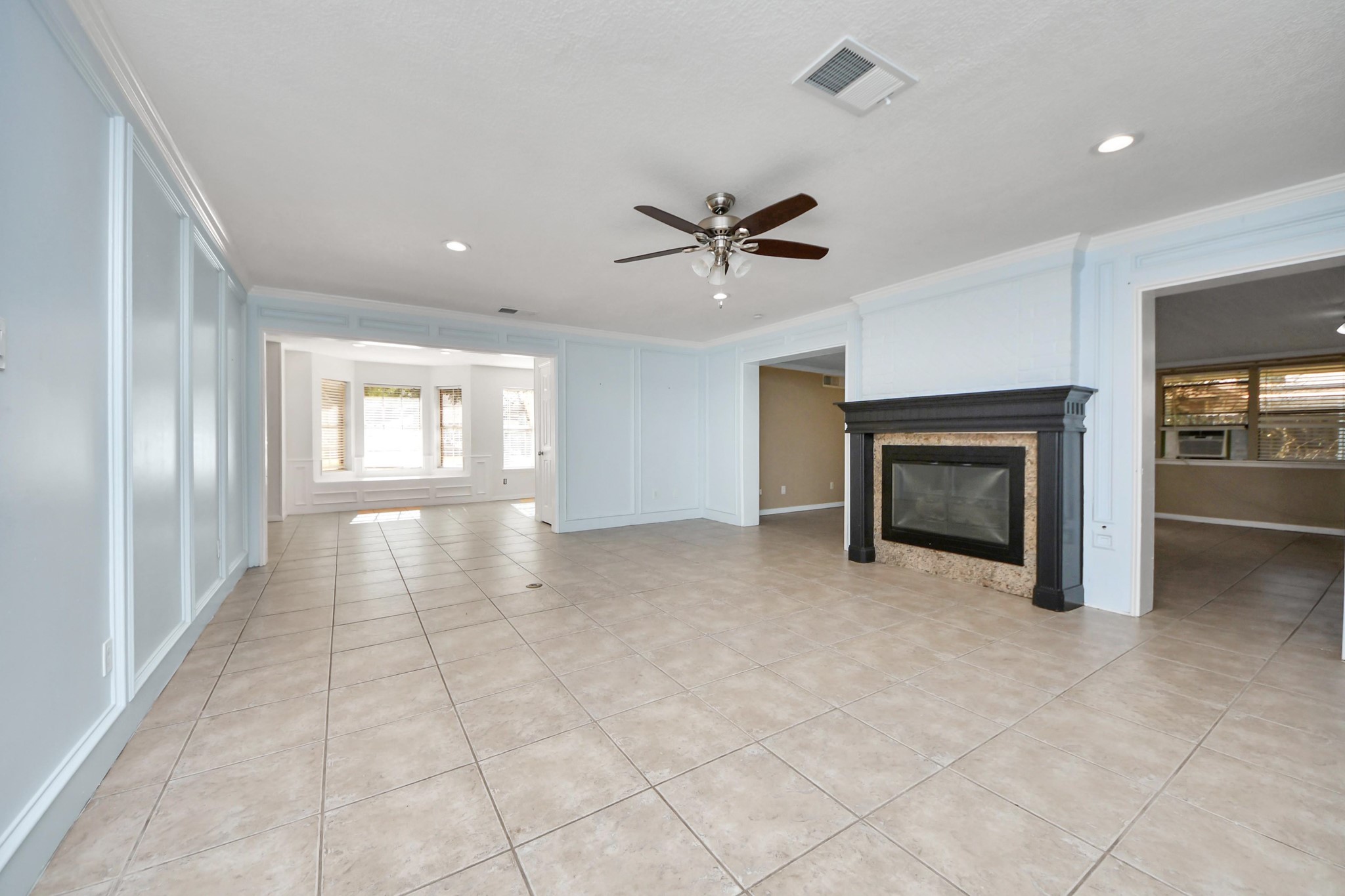 5003 Chantry Drive Houston, TX 77084 - Photo 11 of 49 a view of an empty room with a fireplace and a window