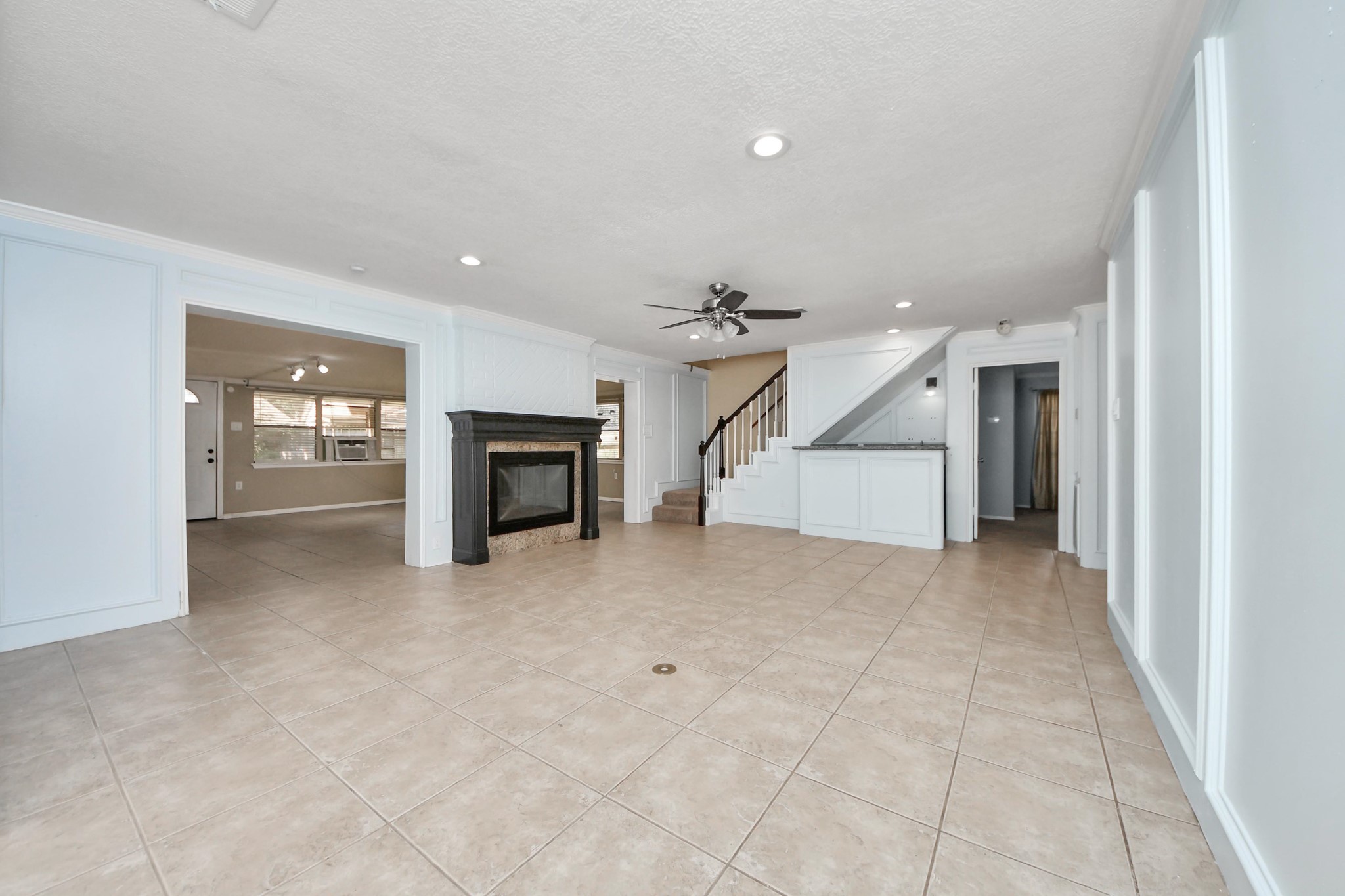 5003 Chantry Drive Houston, TX 77084 - Photo 12 of 49 an empty room with fireplace and a window