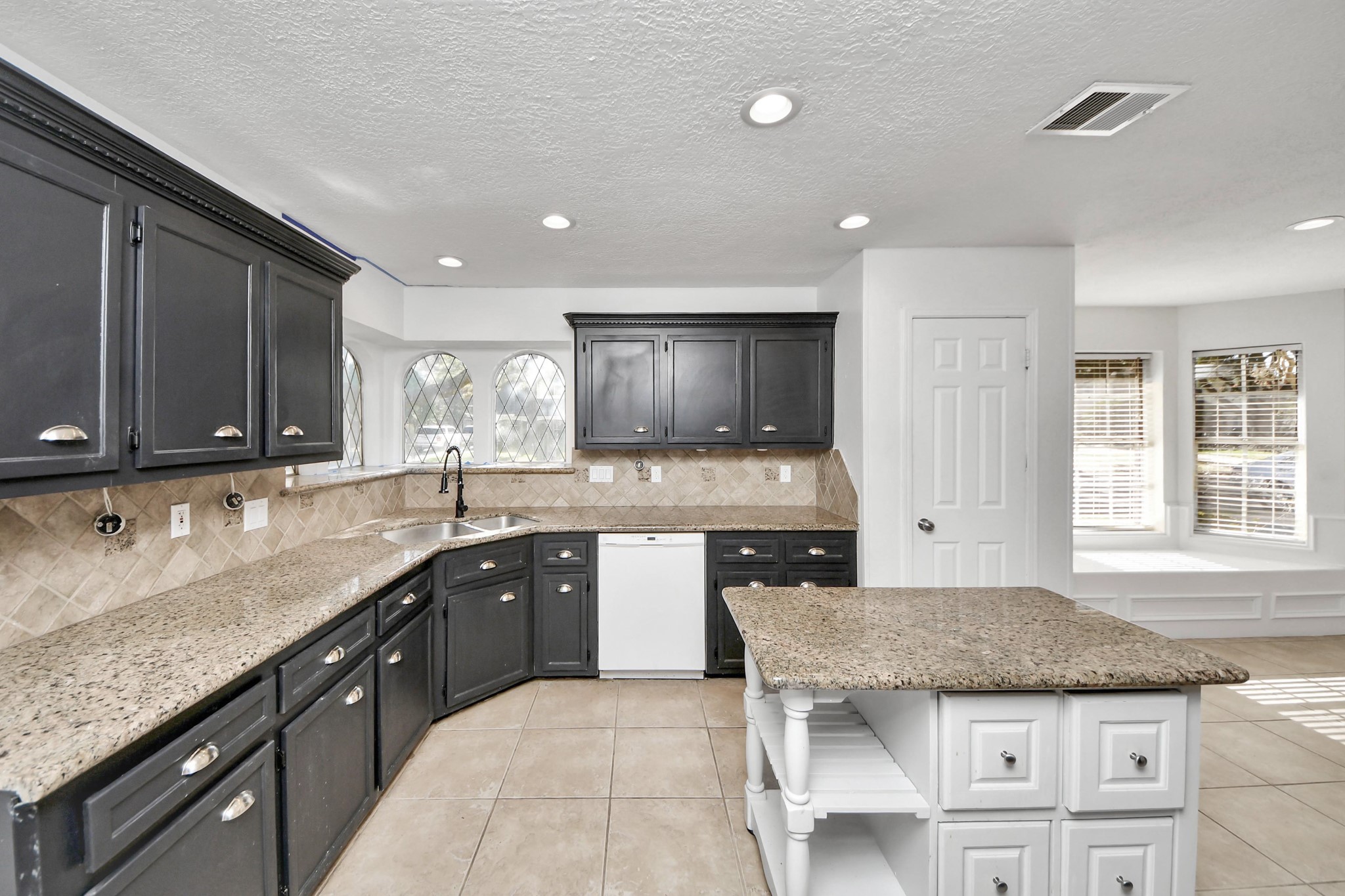 5003 Chantry Drive Houston, TX 77084 - Photo 15 of 49 a kitchen with granite countertop kitchen island sink and cabinets