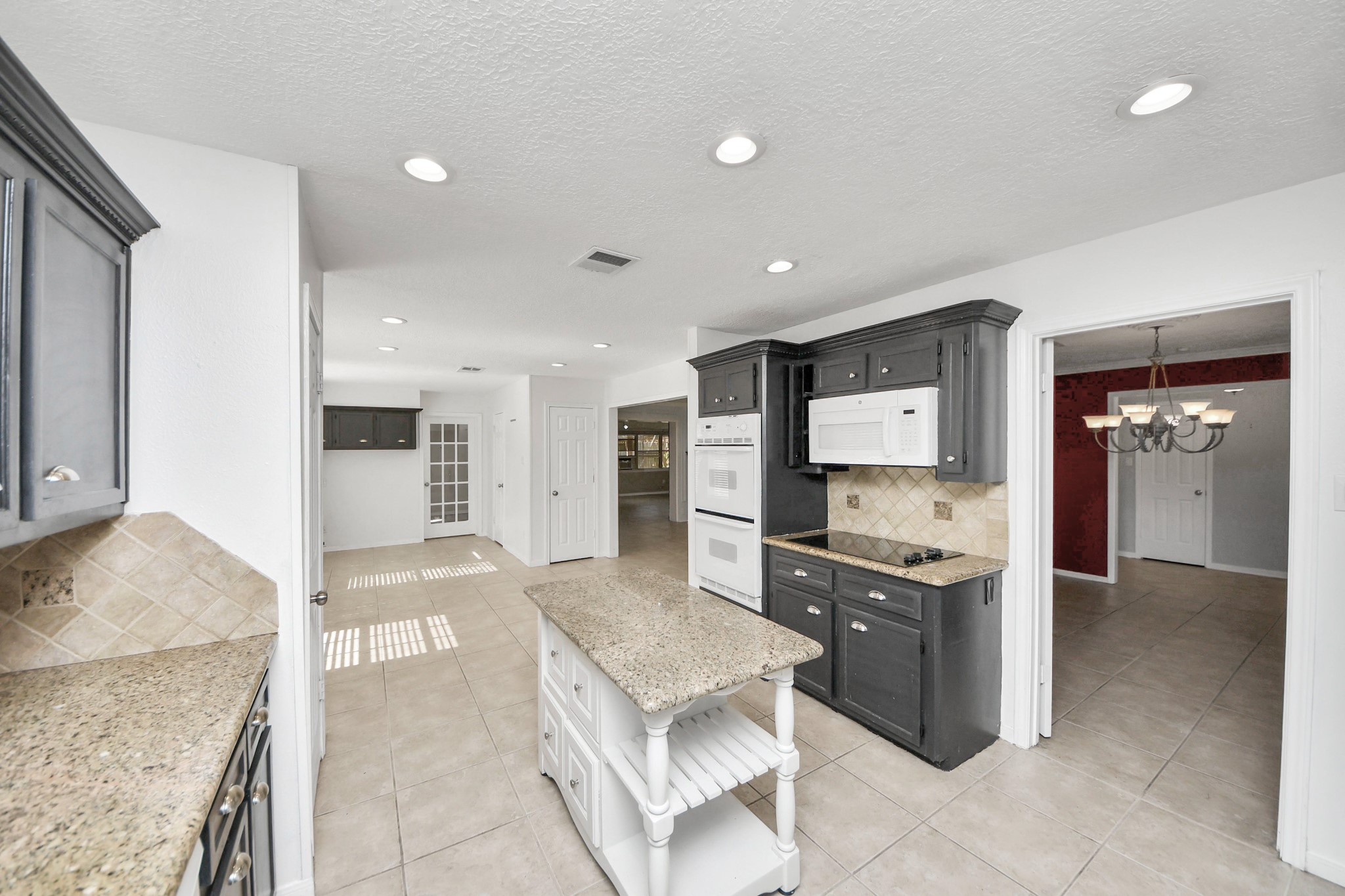 5003 Chantry Drive Houston, TX 77084 - Photo 19 of 49 a kitchen with stainless steel appliances granite countertop a sink and a stove
