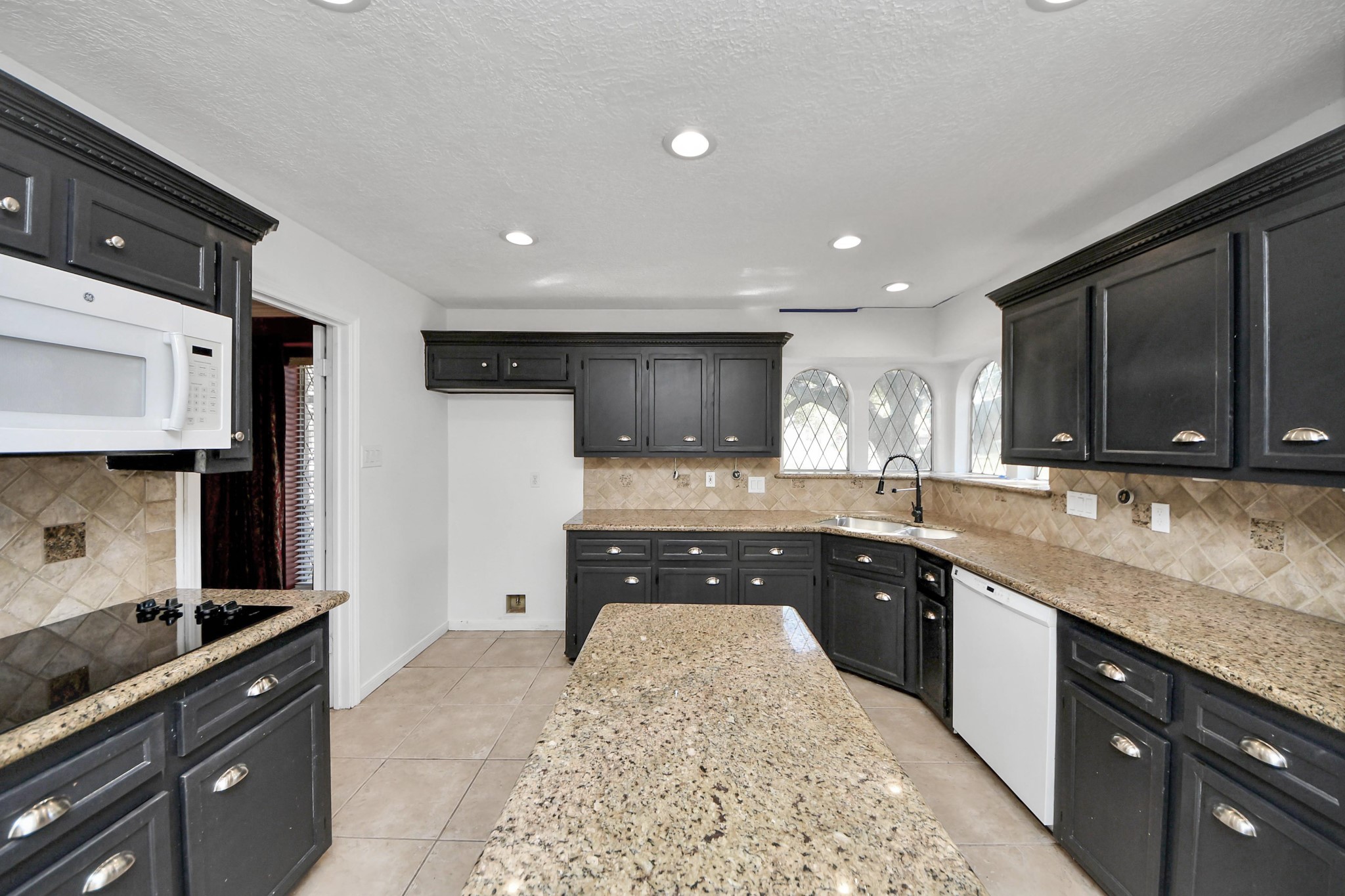 5003 Chantry Drive Houston, TX 77084 - Photo 20 of 49 a kitchen with stainless steel appliances granite countertop a sink a stove and a refrigerator