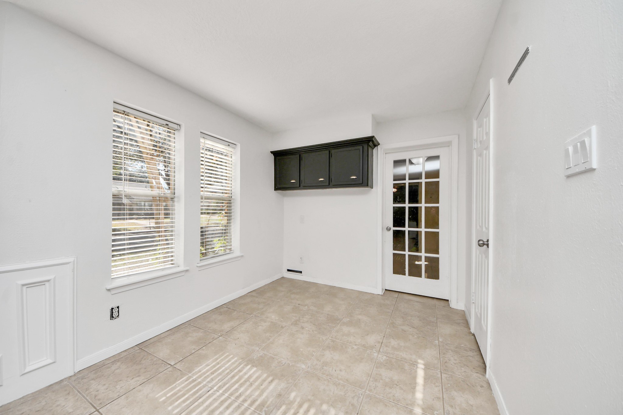 5003 Chantry Drive Houston, TX 77084 - Photo 24 of 49 a view of an empty room with a window and cabinet