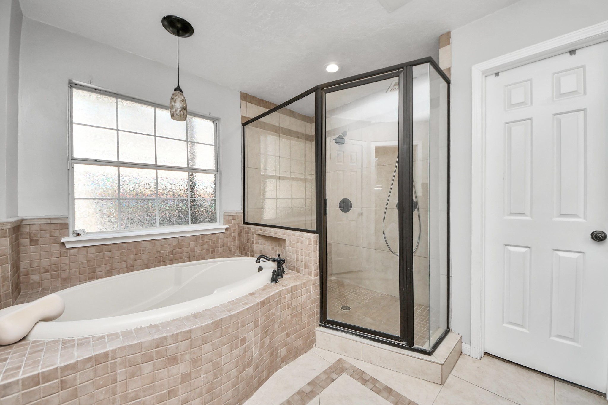 5003 Chantry Drive Houston, TX 77084 - Photo 30 of 49 a white bath tub sitting next to a shower