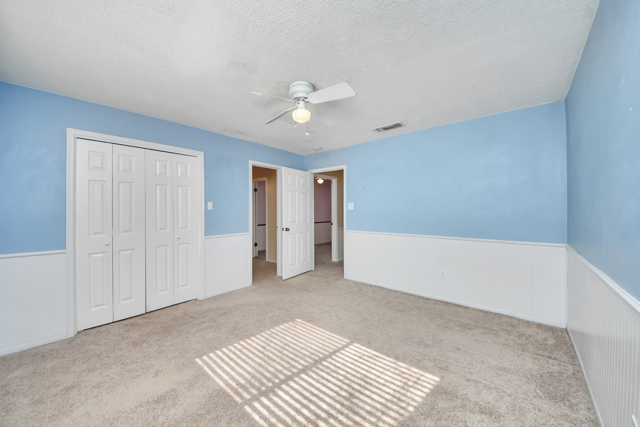 5003 Chantry Drive Houston, TX 77084 - Photo 38 of 49 a view of an empty room with a ceiling fan