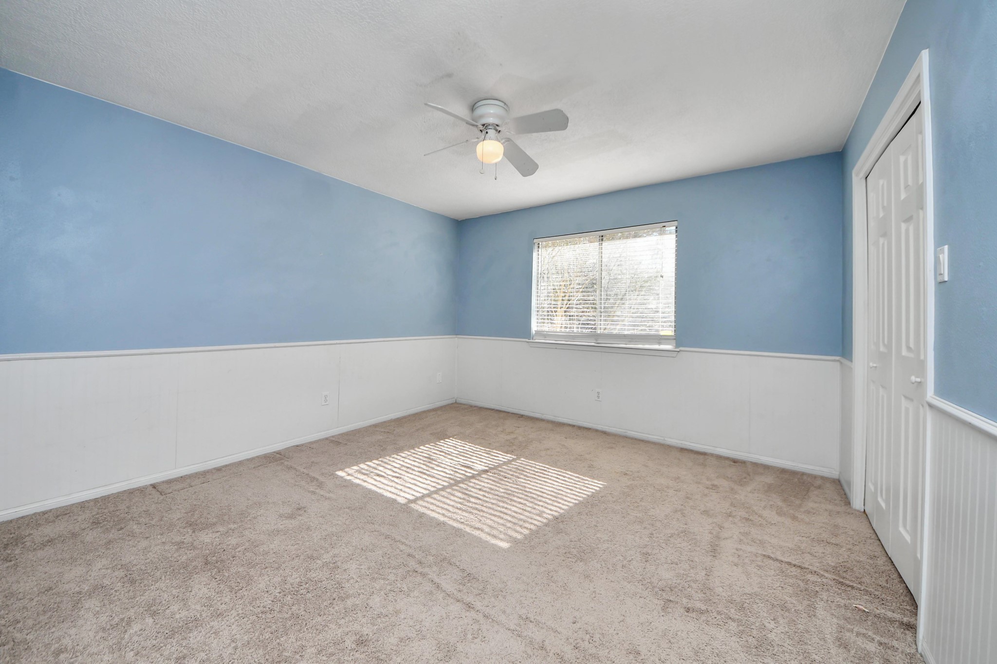 5003 Chantry Drive Houston, TX 77084 - Photo 39 of 49 an empty room with windows and fan