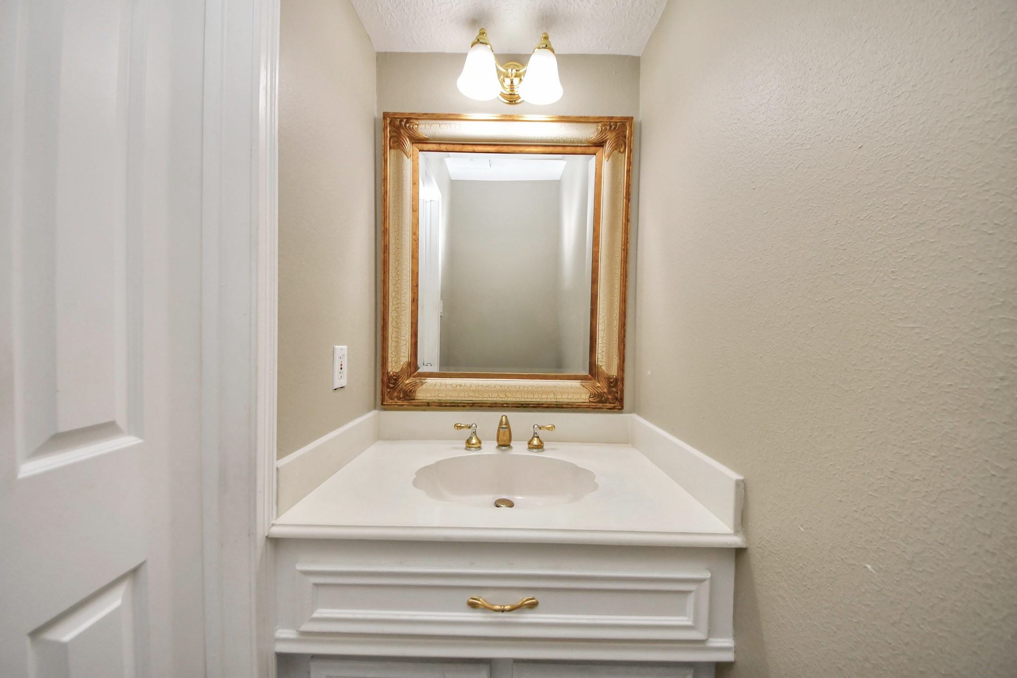 5003 Chantry Drive Houston, TX 77084 - Photo 44 of 49 a bathroom with a sink and a mirror