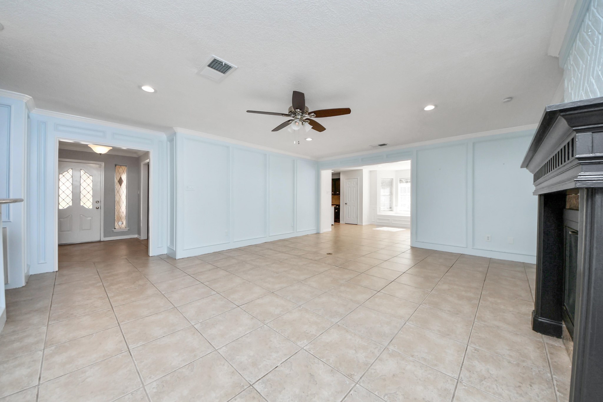 5003 Chantry Drive Houston, TX 77084 - Photo 10 of 49 a view of an empty room and a ceiling fan window