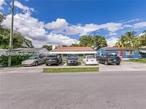 a front view of a house with a garden and pathway