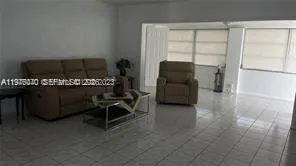 a room with furniture and a flat screen tv